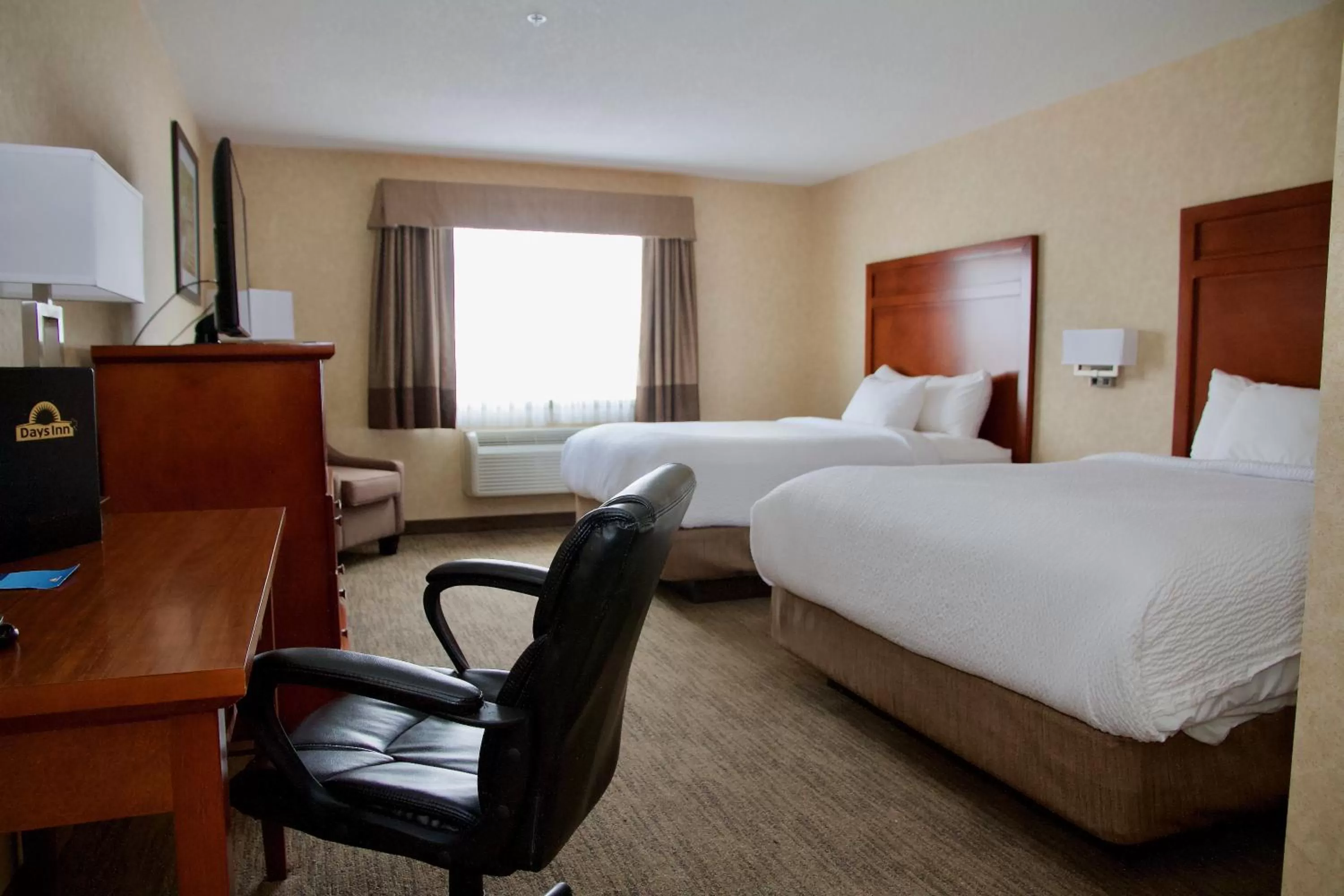 Photo of the whole room, Bed in Days Inn & Suites by Wyndham Brooks