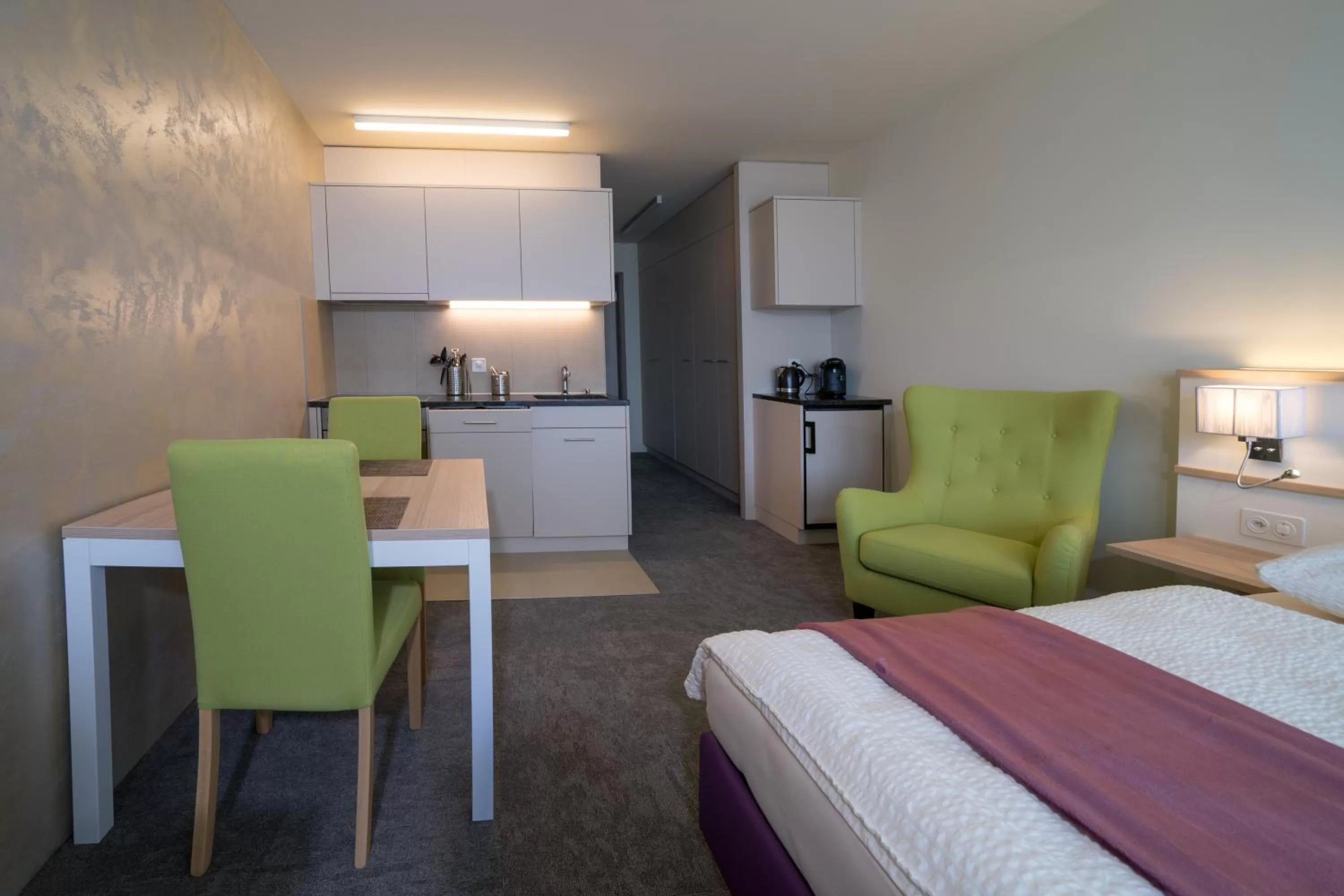 Kitchen or kitchenette, Bed in wohnMOTEL - Hinterforst