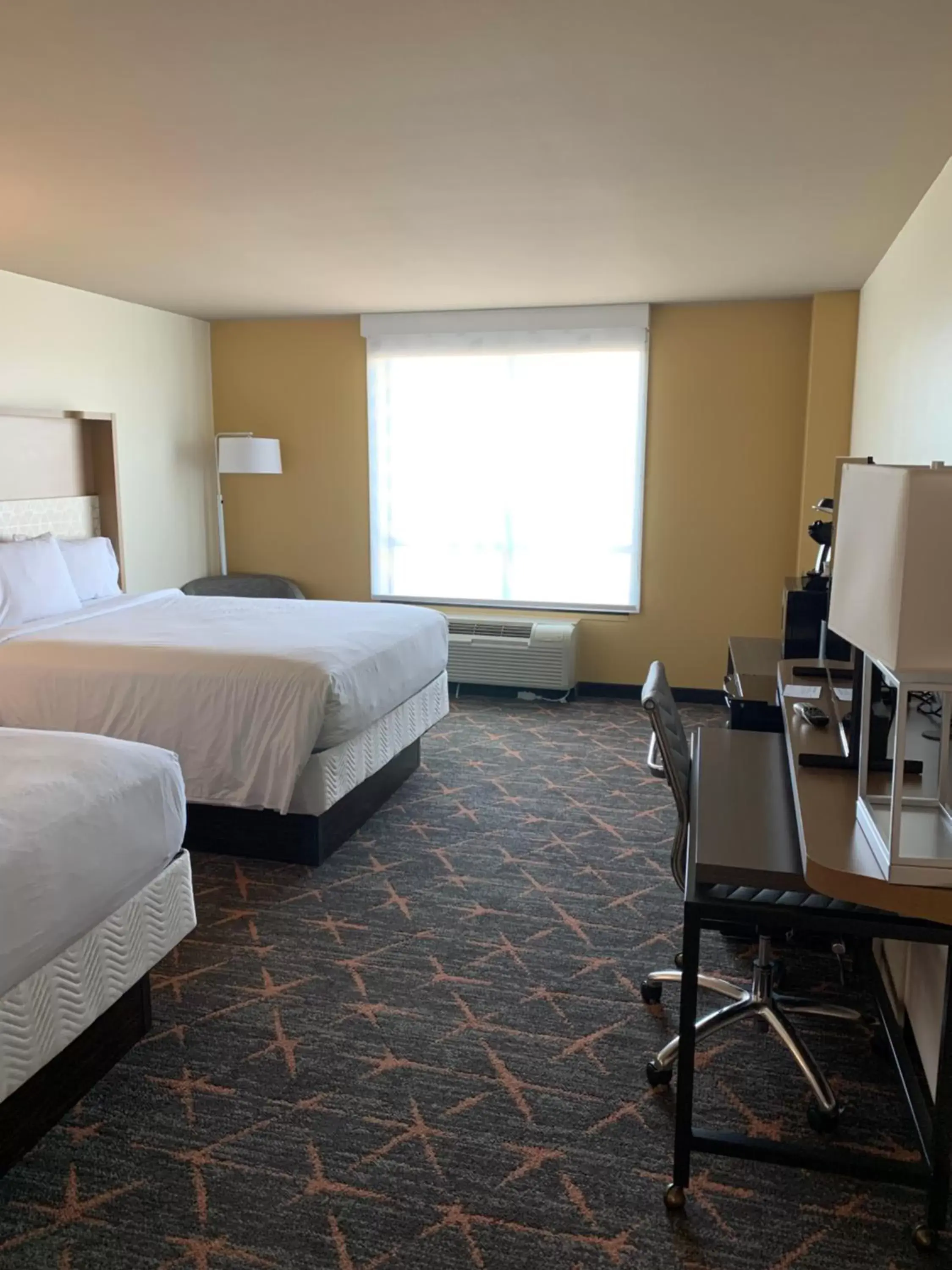 Bedroom in Holiday Inn & Suites Stillwater-University West, an IHG Hotel