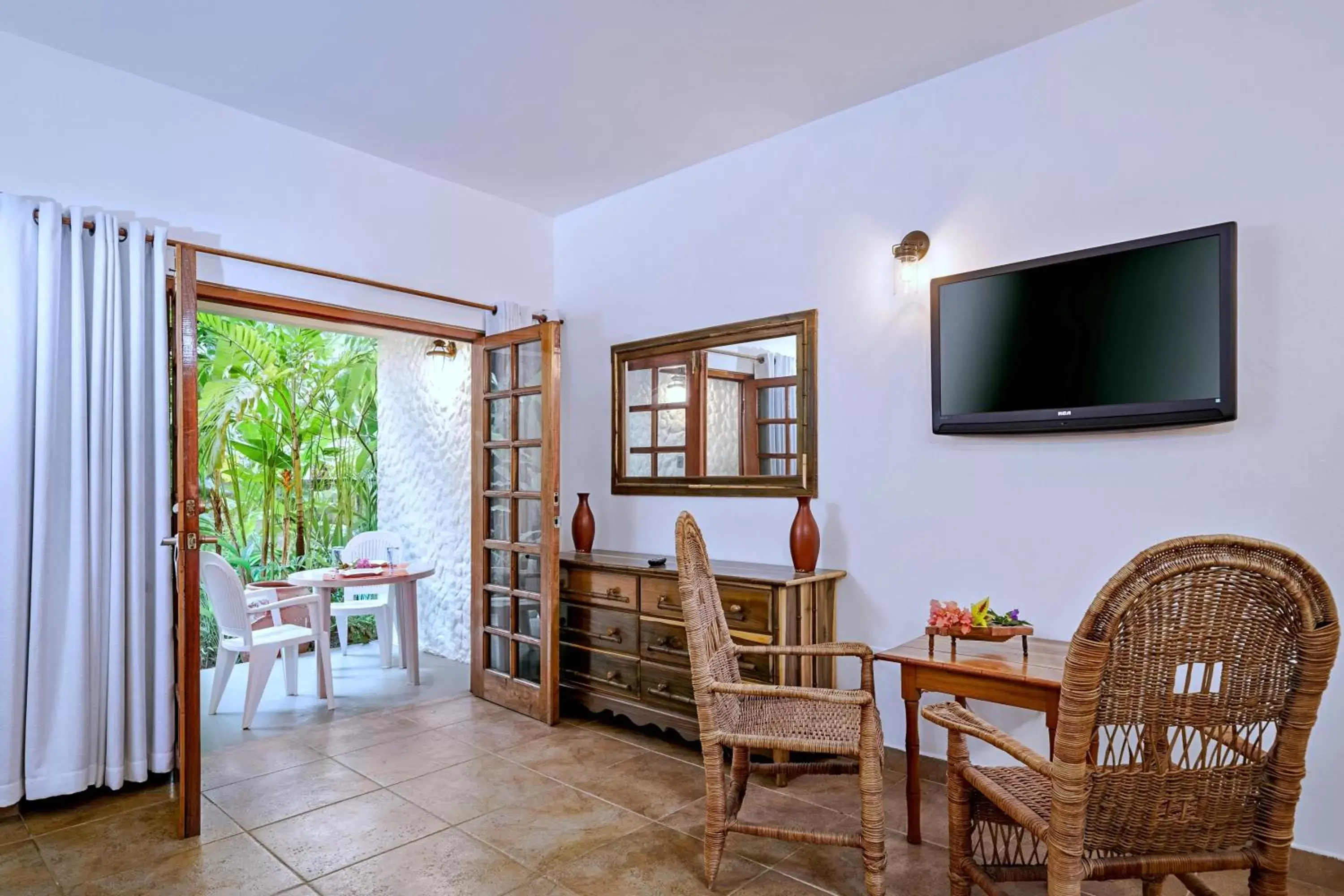 Living room, TV/Entertainment Center in Beach House Condos, Negril