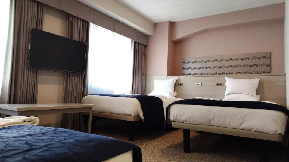 Bed in Hotel Rose Garden Shinjuku