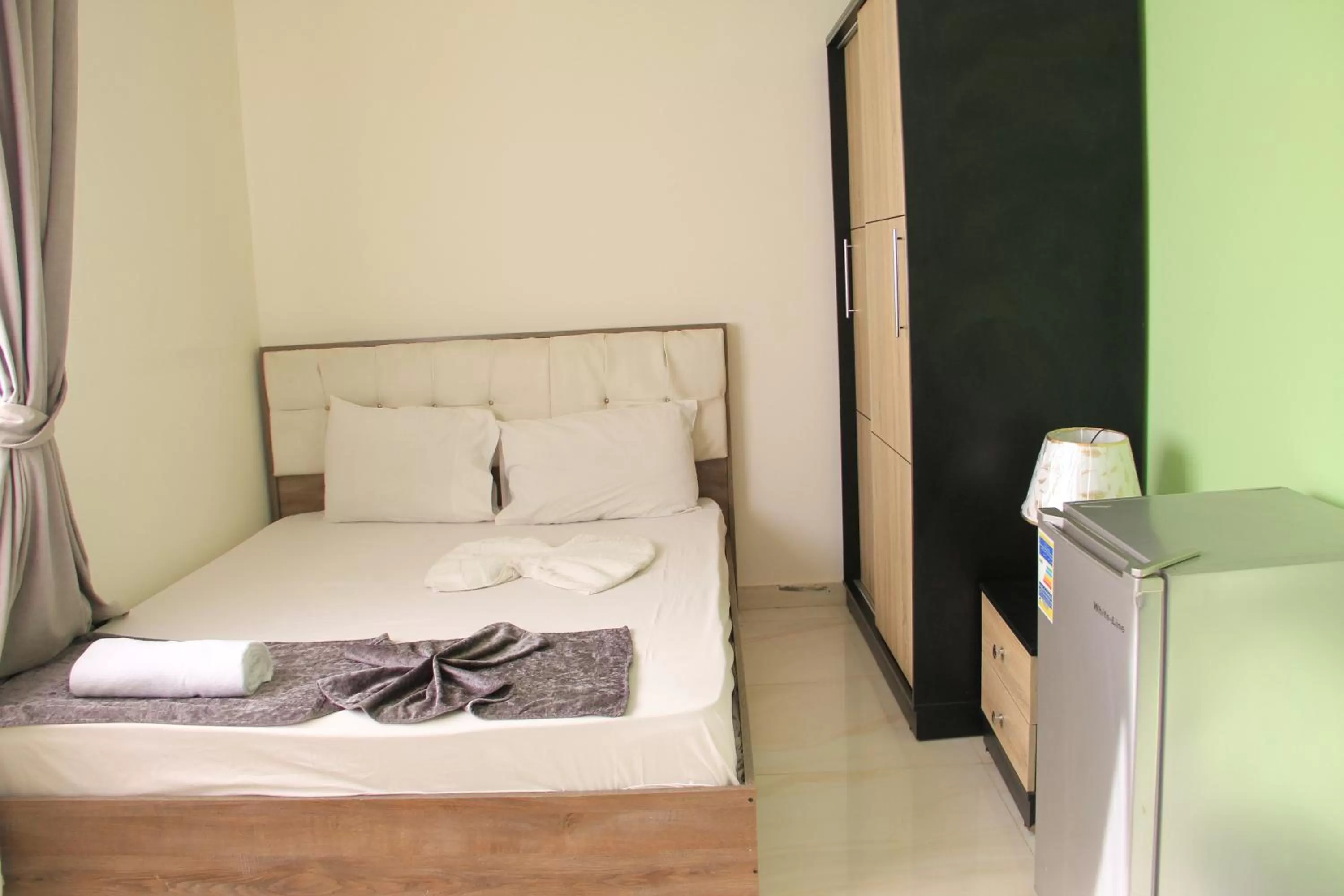 Bed in Gardenia Inn Hotel