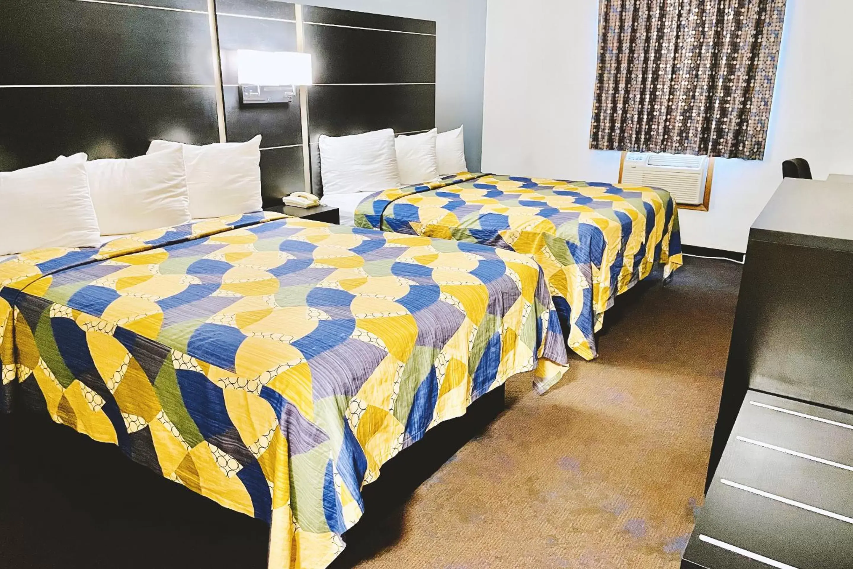 Bed in Coratel Inn & Suites by Jasper Northfield