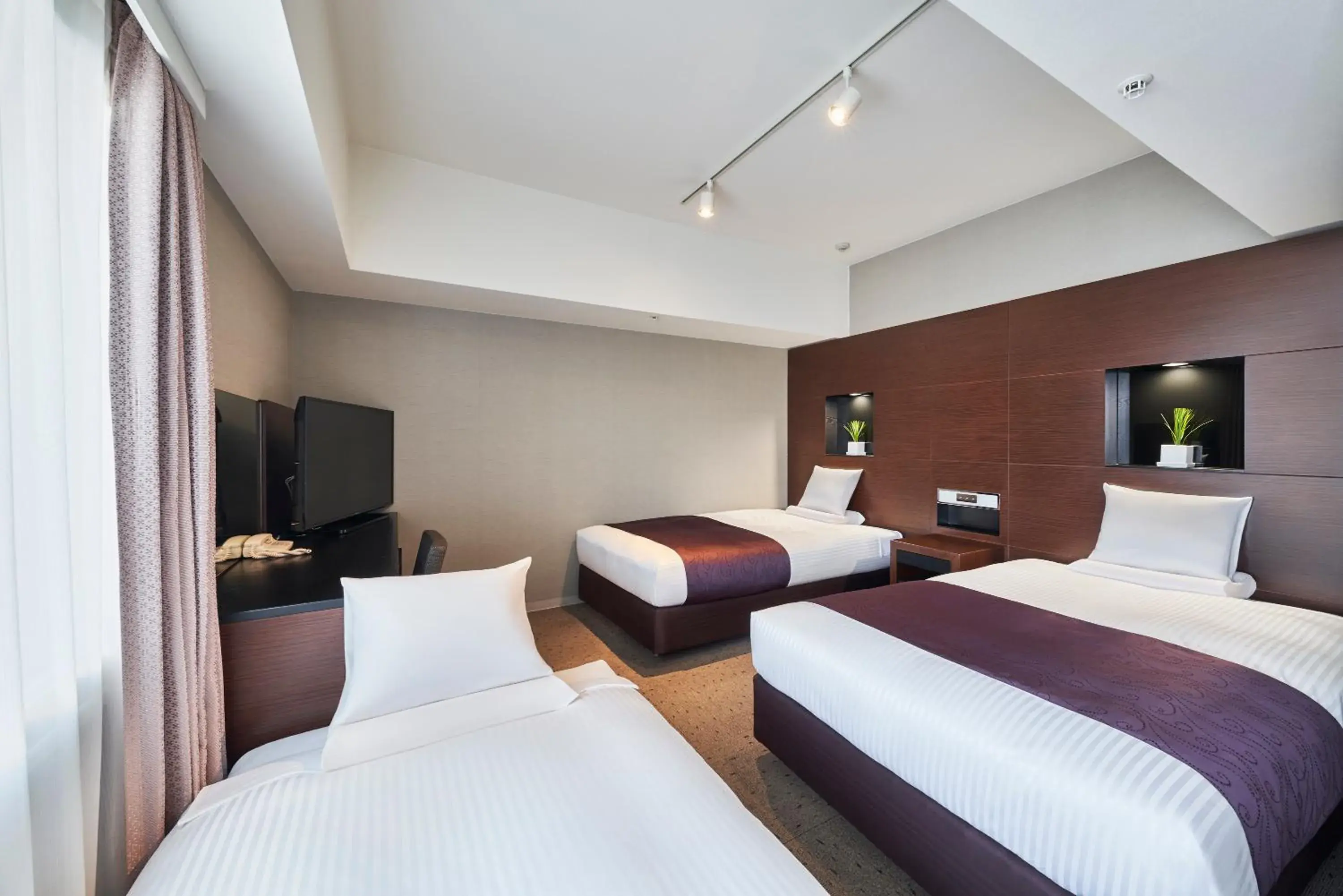 Bed in HOTEL MYSTAYS Shimizu