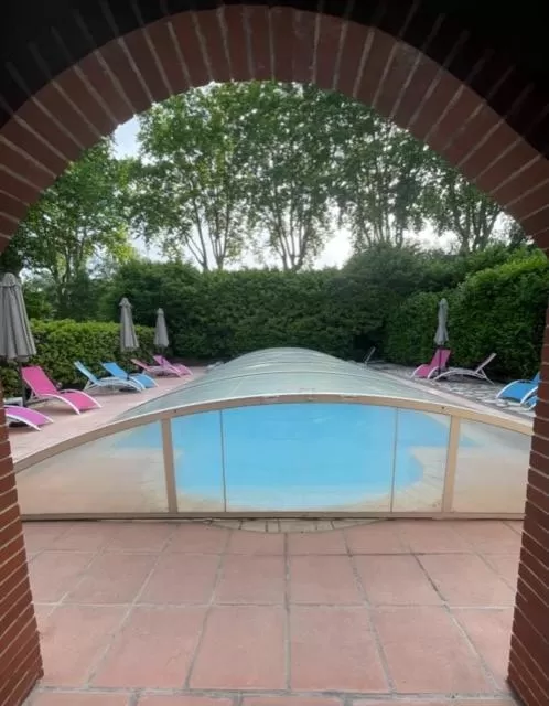 Swimming pool in Logis Hotel Restaurant Le Domaine de la Régalière