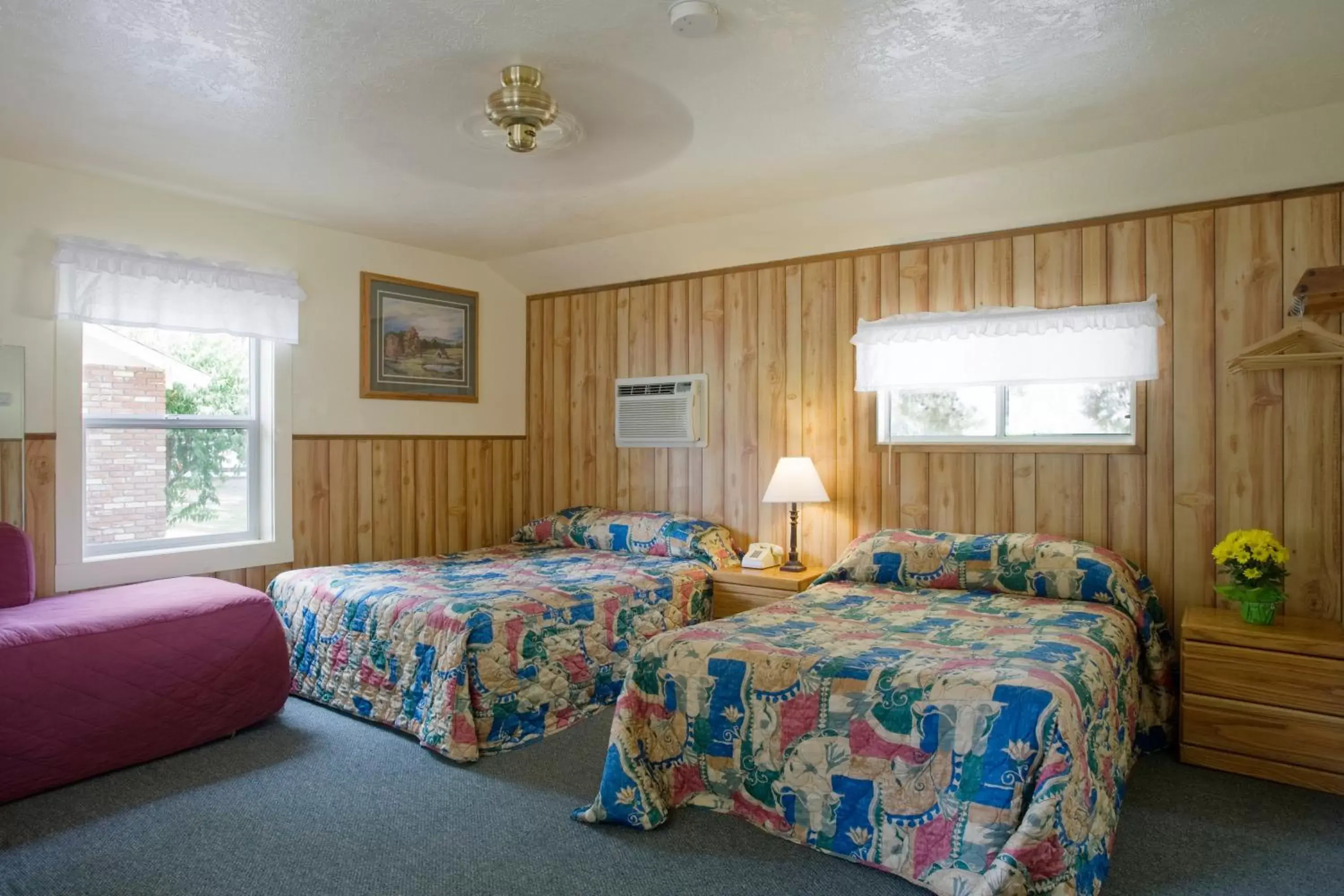 Bed in Lazy J Ranch Motel