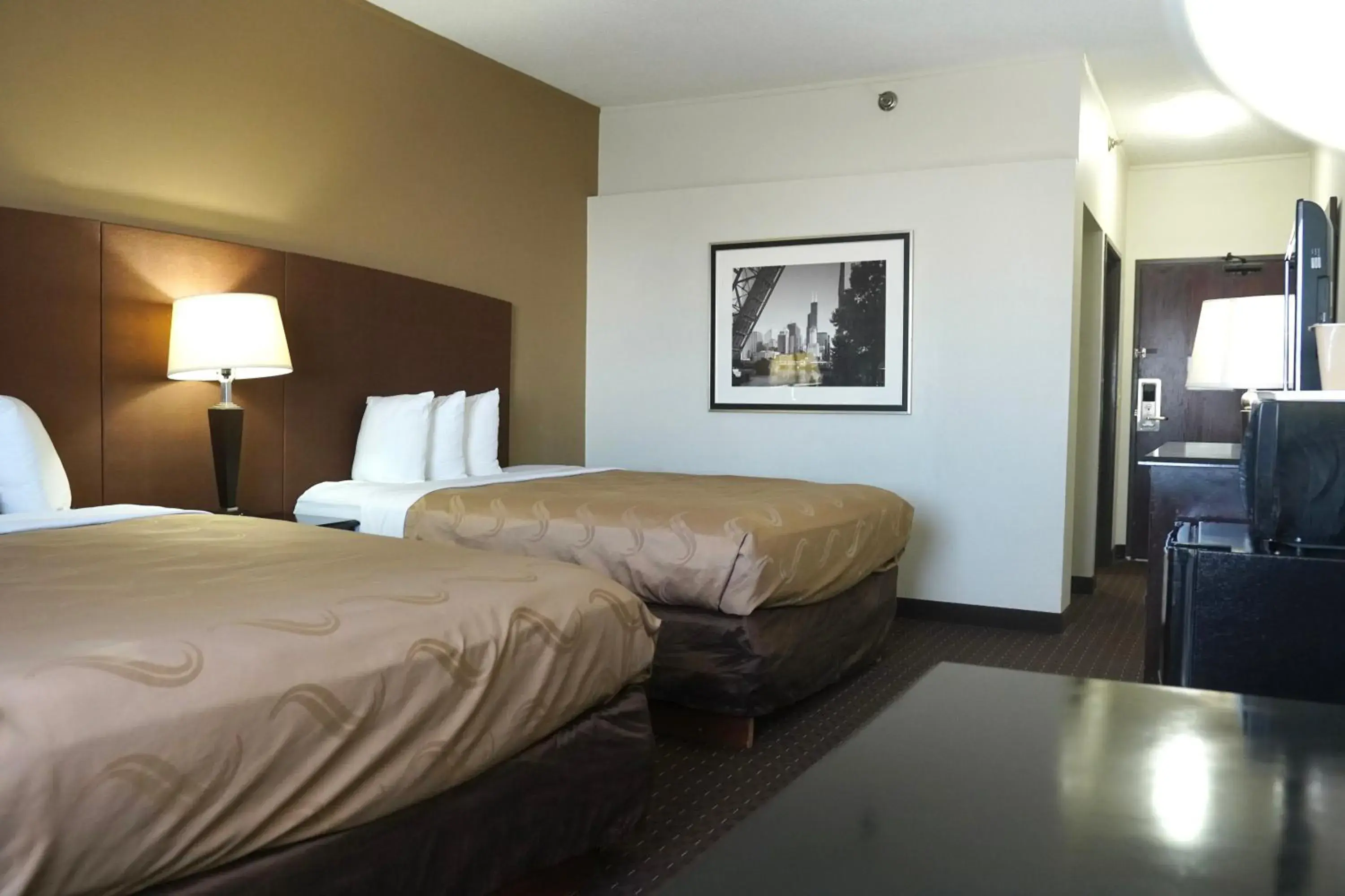 Bed in American Inn & Suites