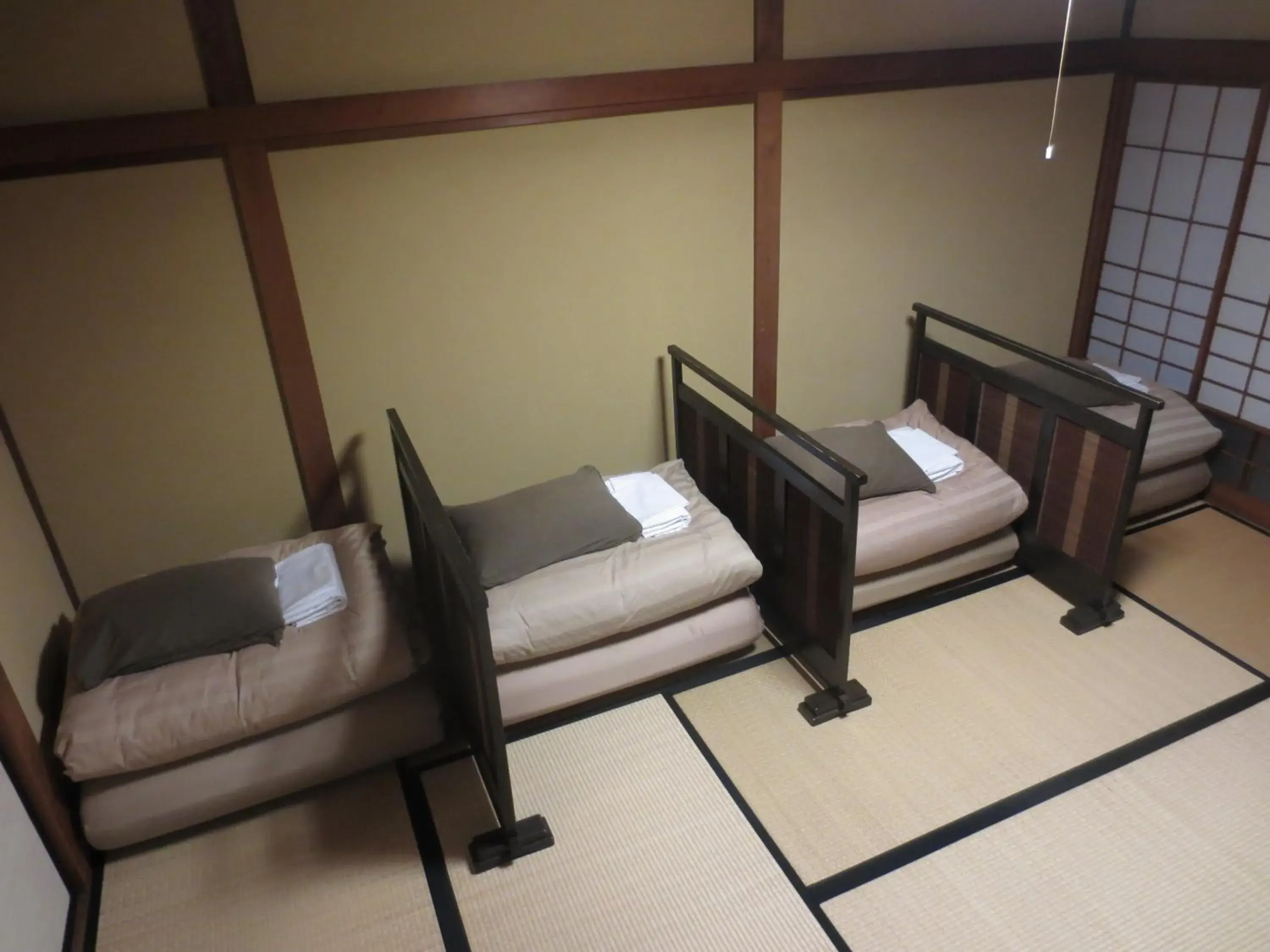 Bed in K's House Ito Onsen - Historical Ryokan Hostel