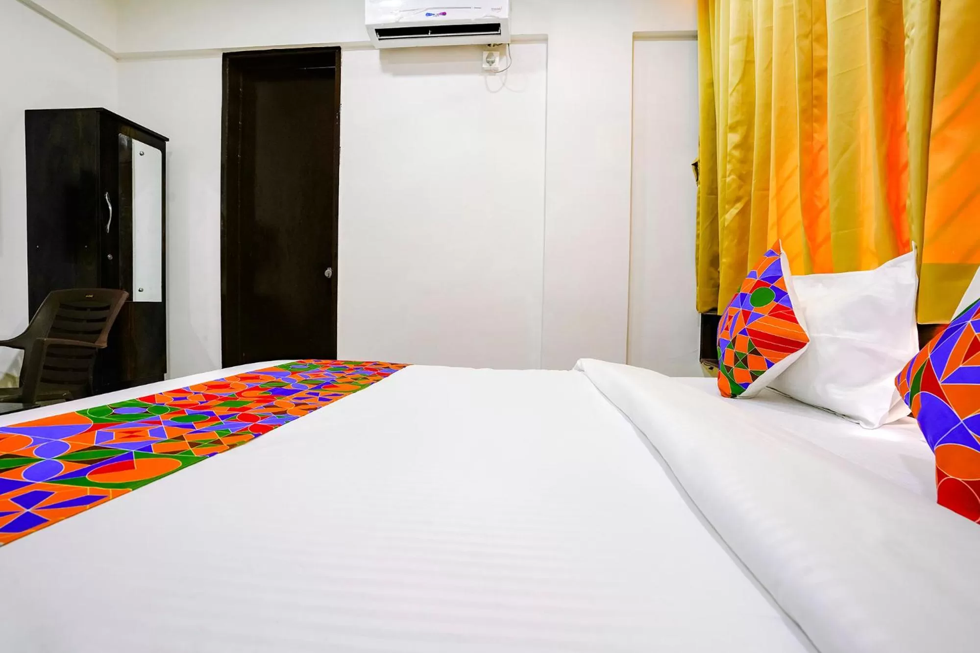 Bed in FabHotel Woods Regency