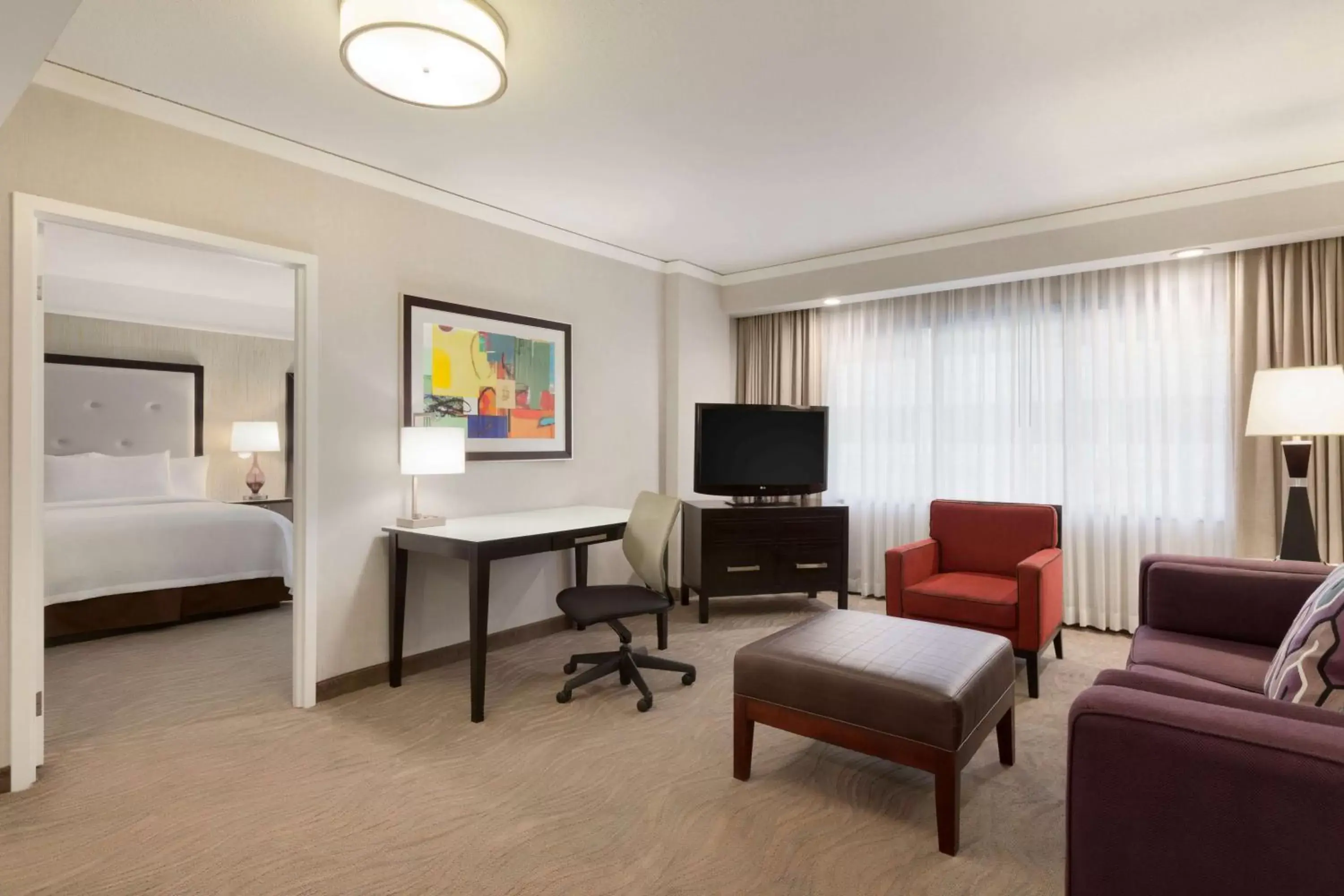 Bed, Seating Area in Embassy Suites by Hilton Irvine Orange County Airport