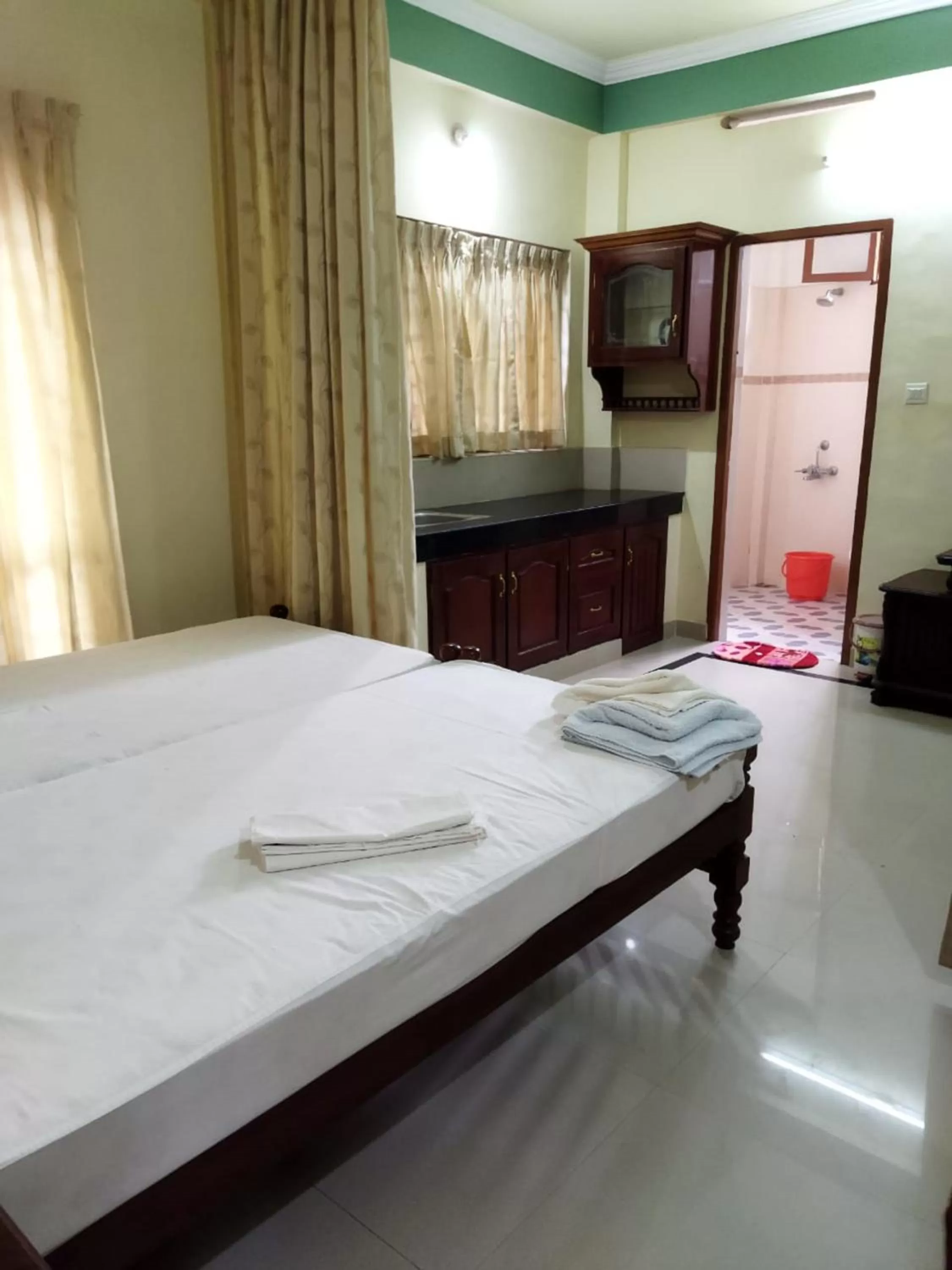 Bed in Sree Mookambika Beach Resort