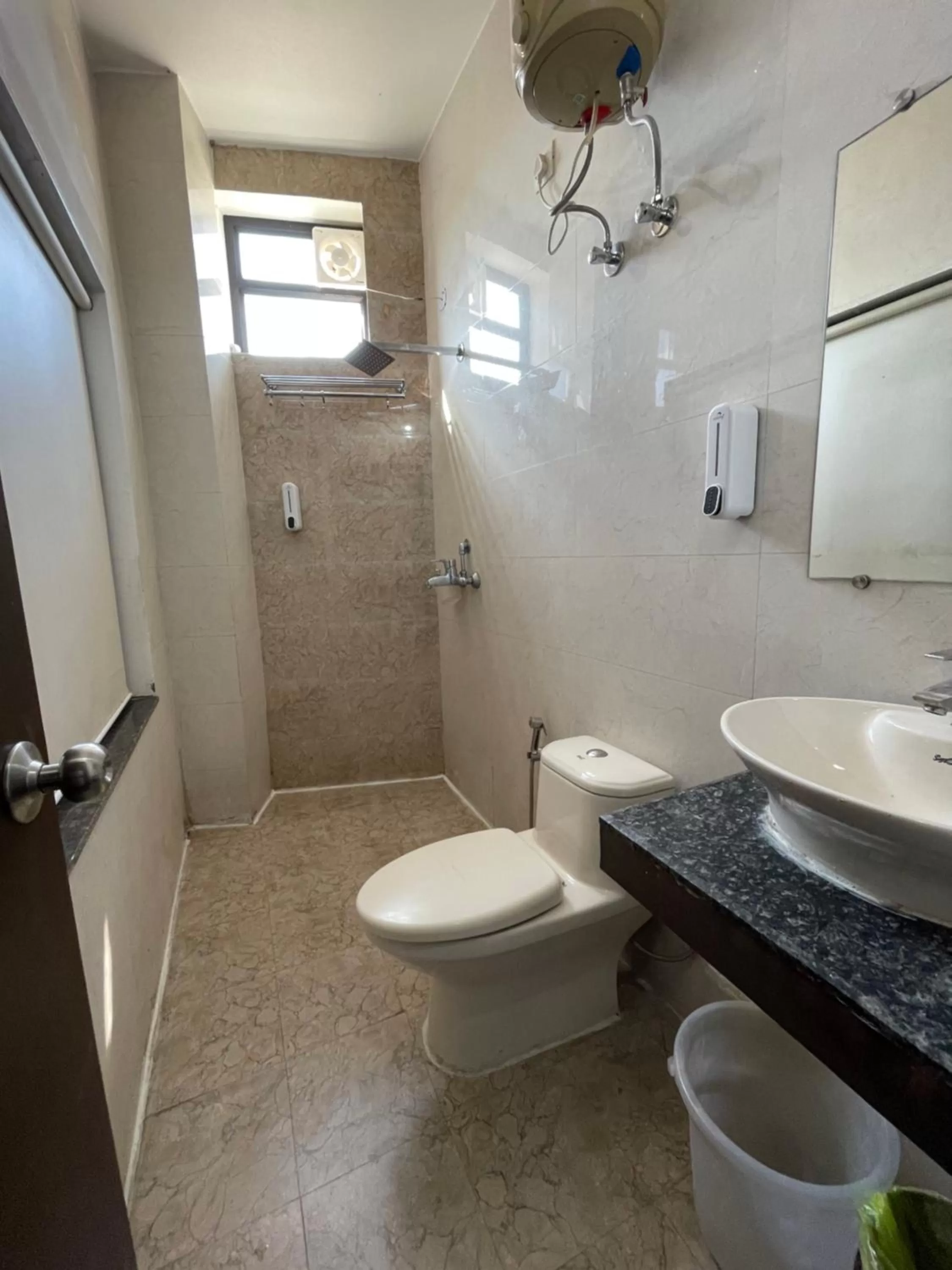 Bathroom in Tapasthali by Meera Hotels