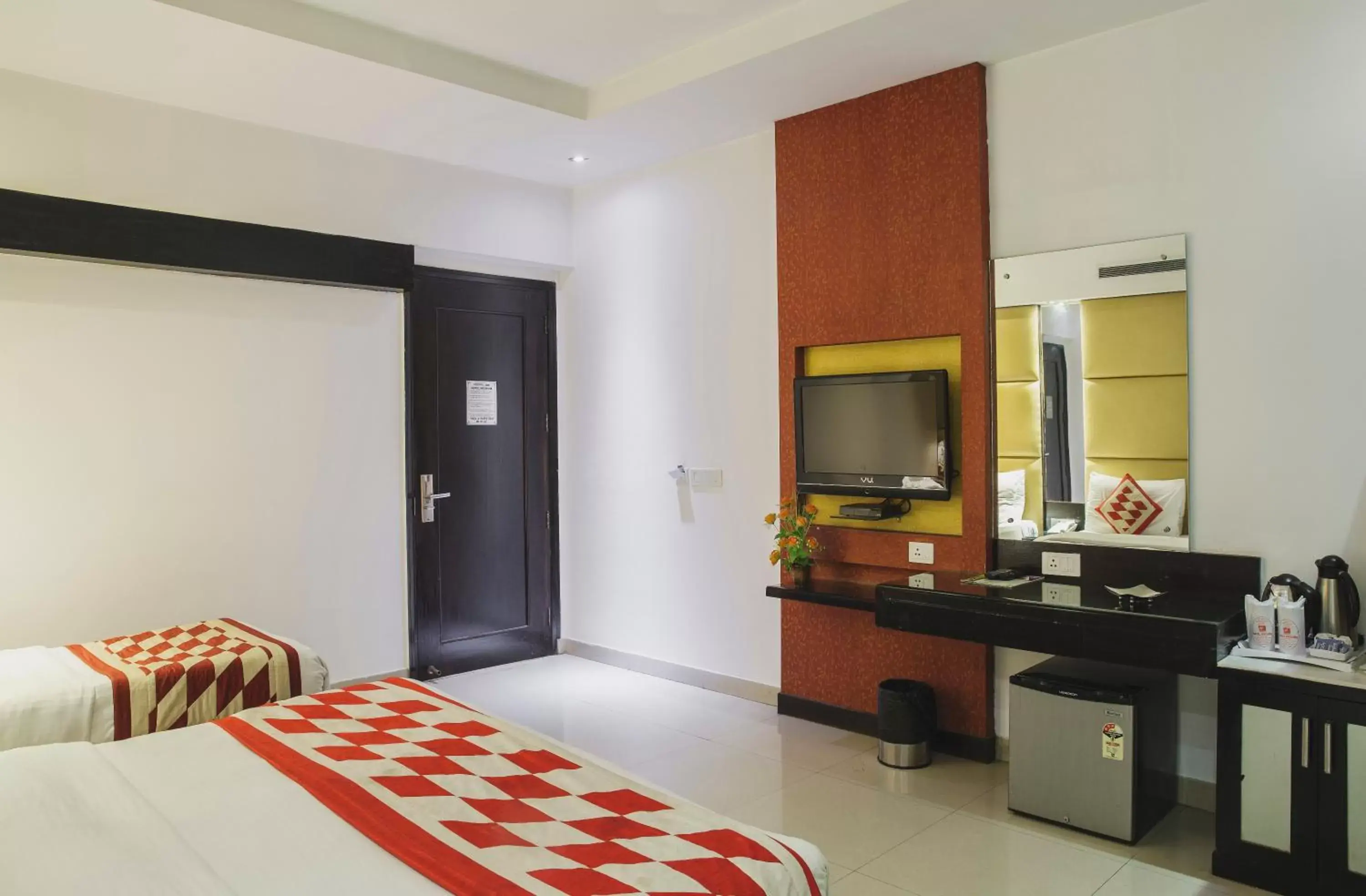 Bed, TV/Entertainment Center in Hotel Krishna - By RCG Hotels