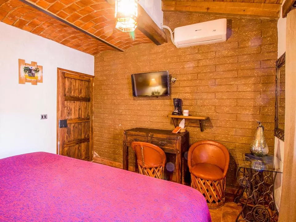 Photo of the whole room, Bed in Hotel Mi Pueblito Tapalpa