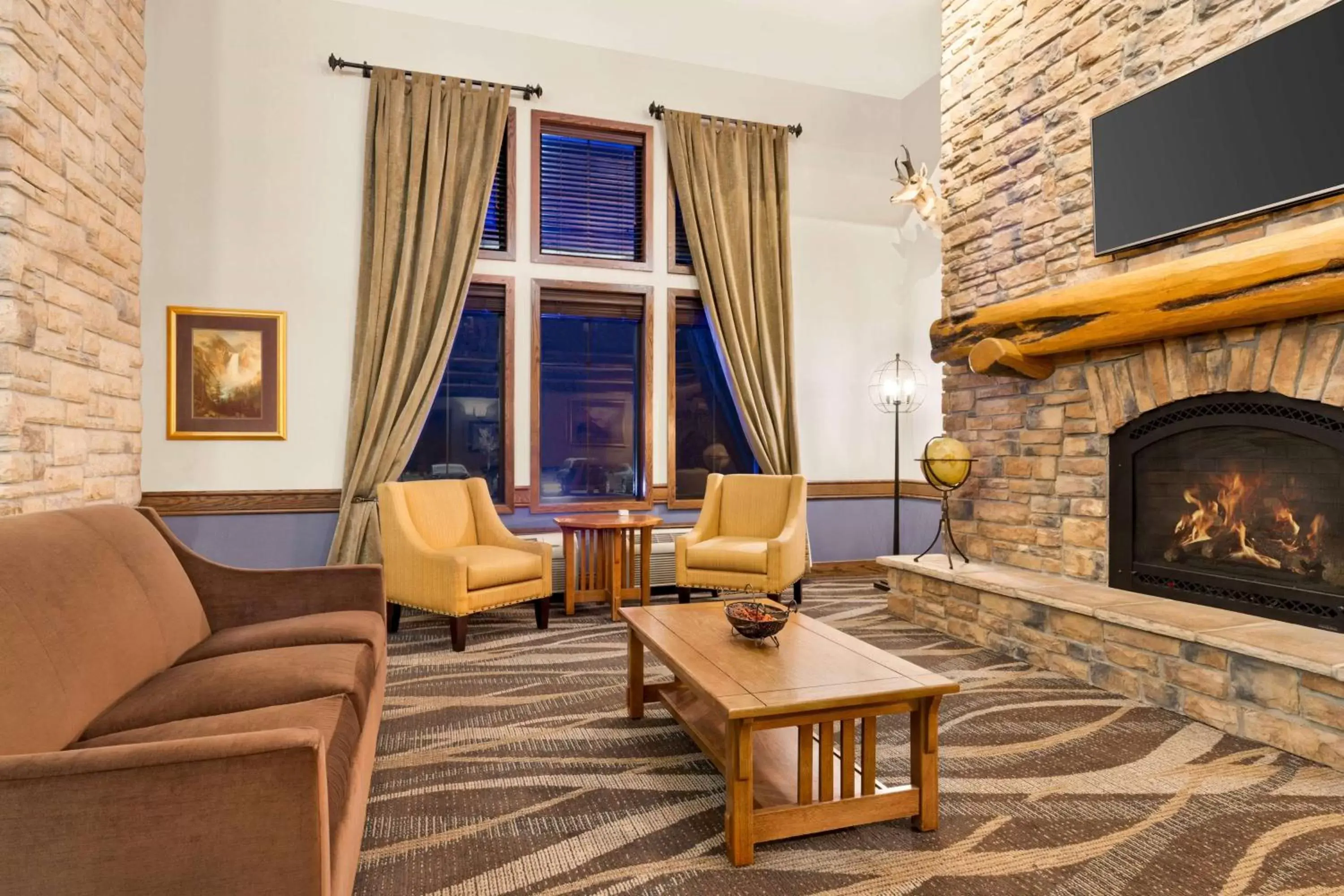 Lobby or reception, Seating Area in AmericInn by Wyndham Laramie Near University of Wyoming