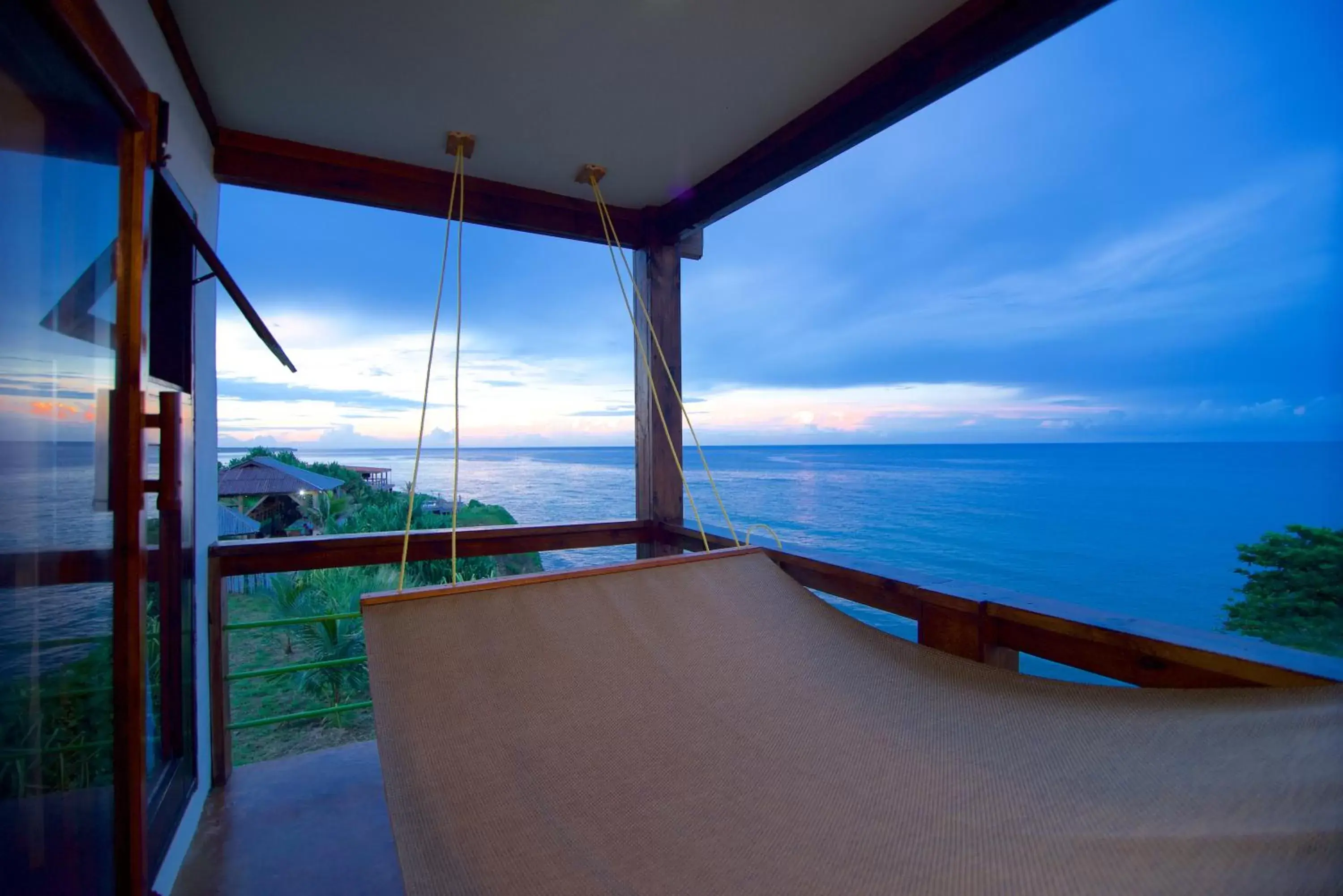 Bed, Balcony/Terrace in The Sea Cliff Hotel Resort & Spa