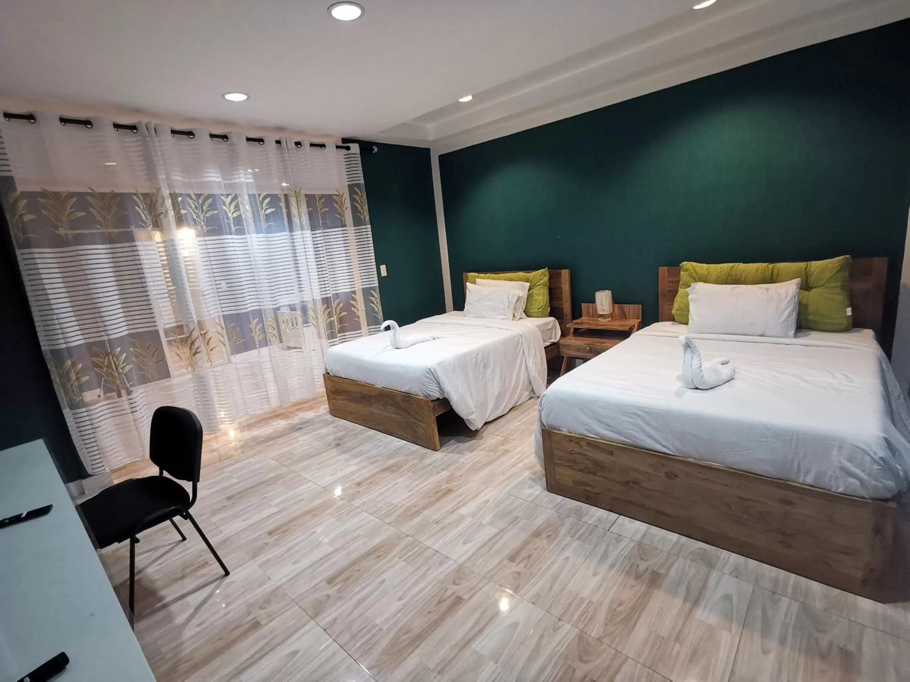 Bed in Pescadores Suites Moalboal