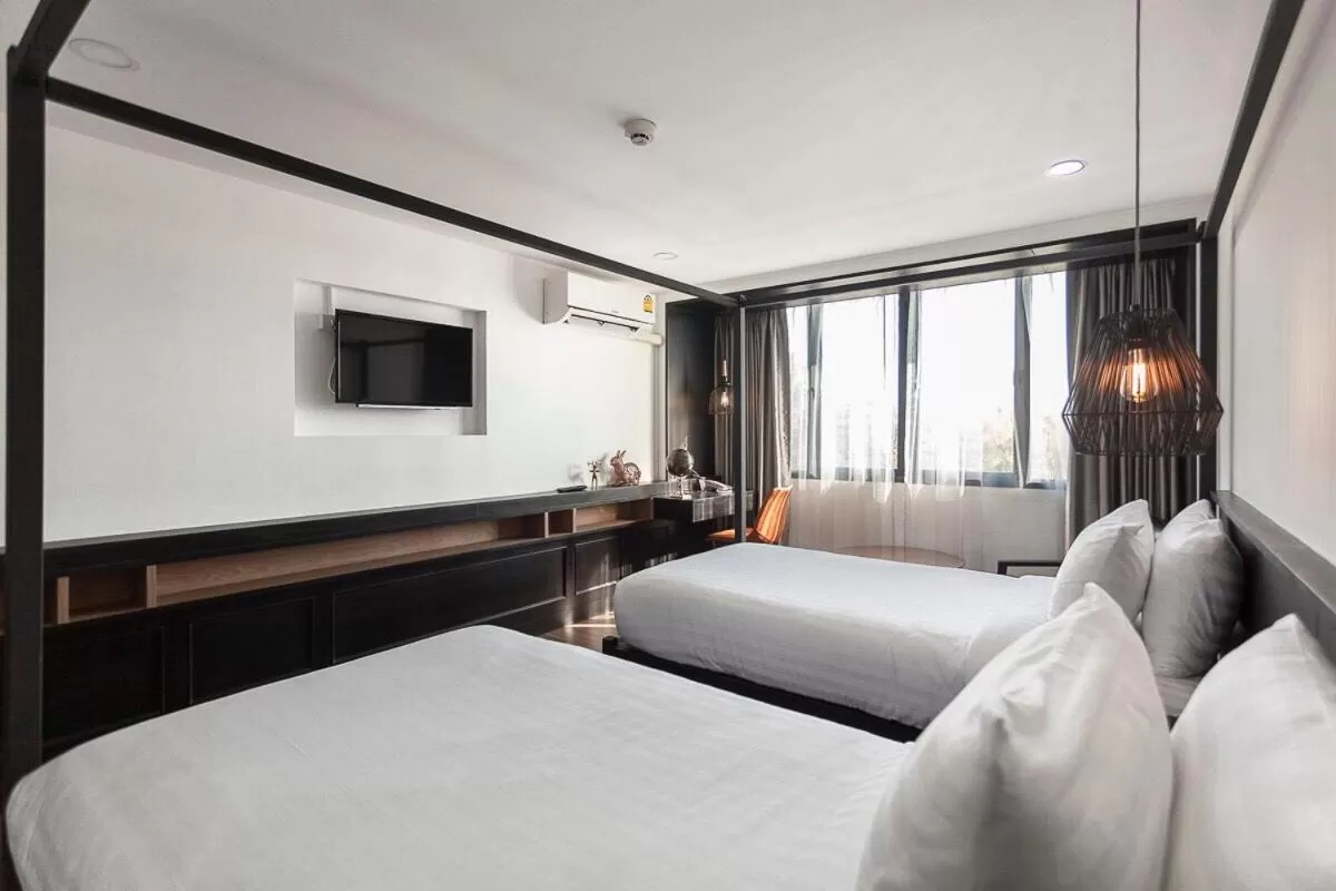 Communal lounge/ TV room, Bed in R1 Nimman Hotel Chiangmai