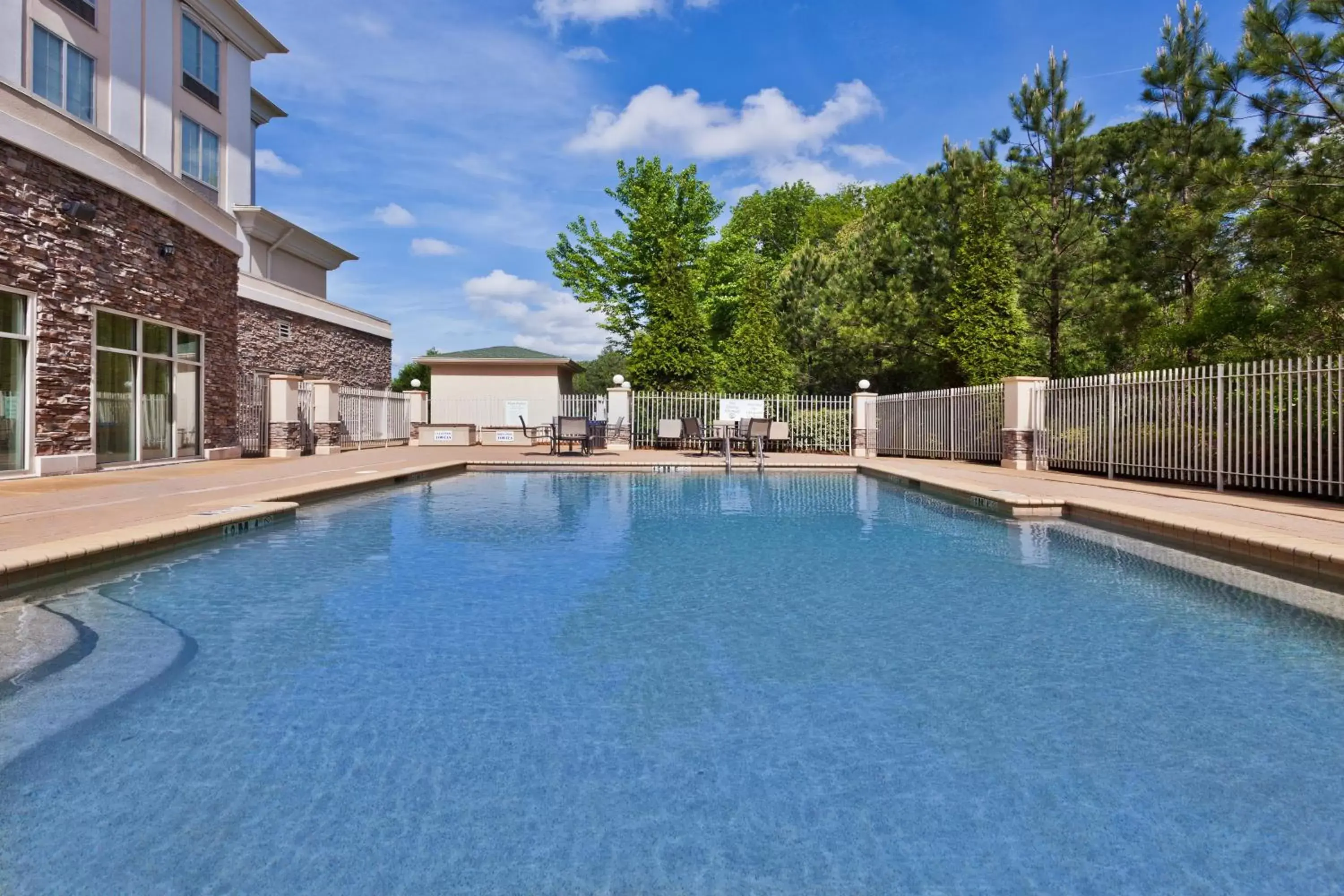 Swimming Pool in Holiday Inn Express Phenix City-Fort Benning, an IHG Hotel