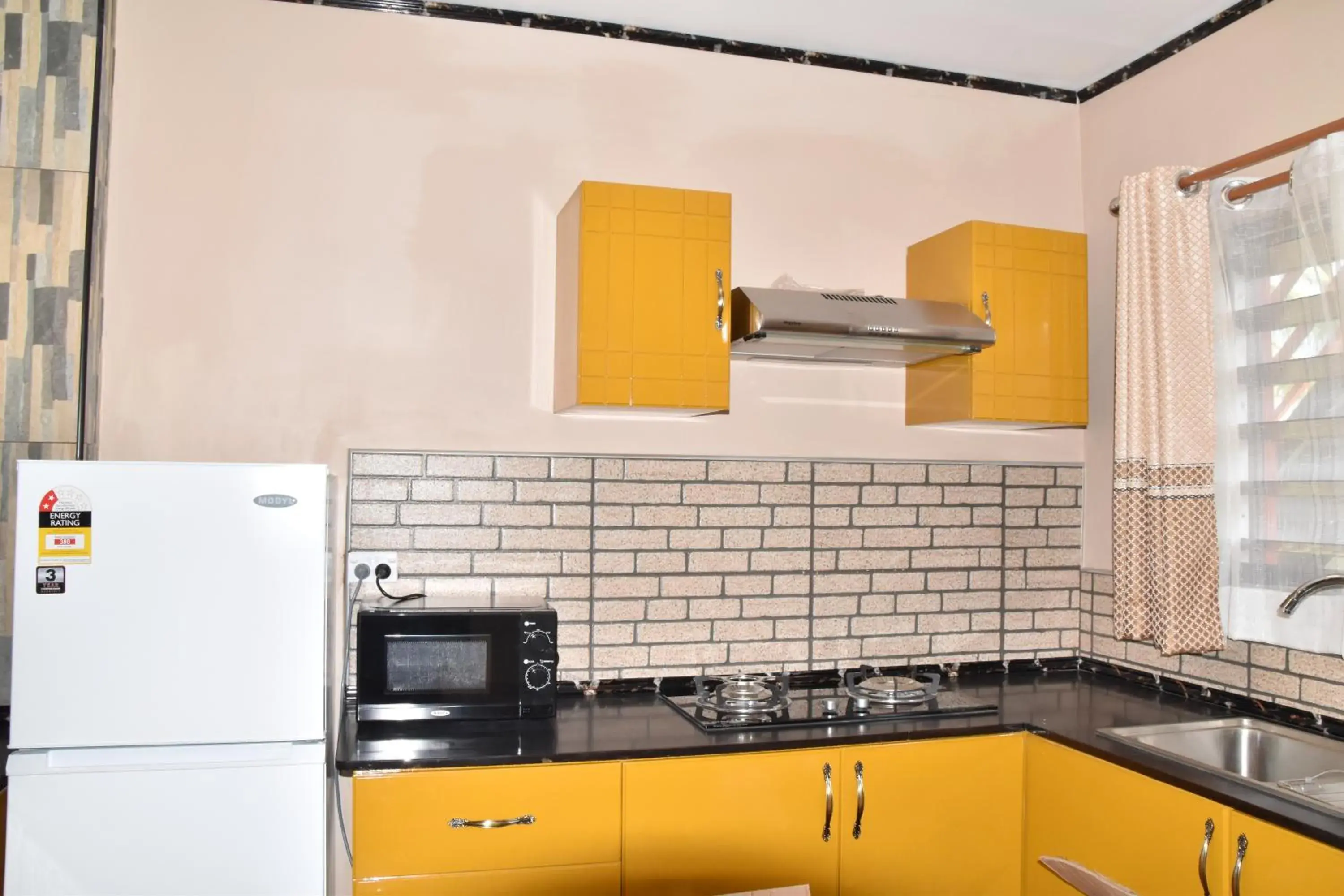 Kitchen/Kitchenette in Al - Minhaj Service Apartments