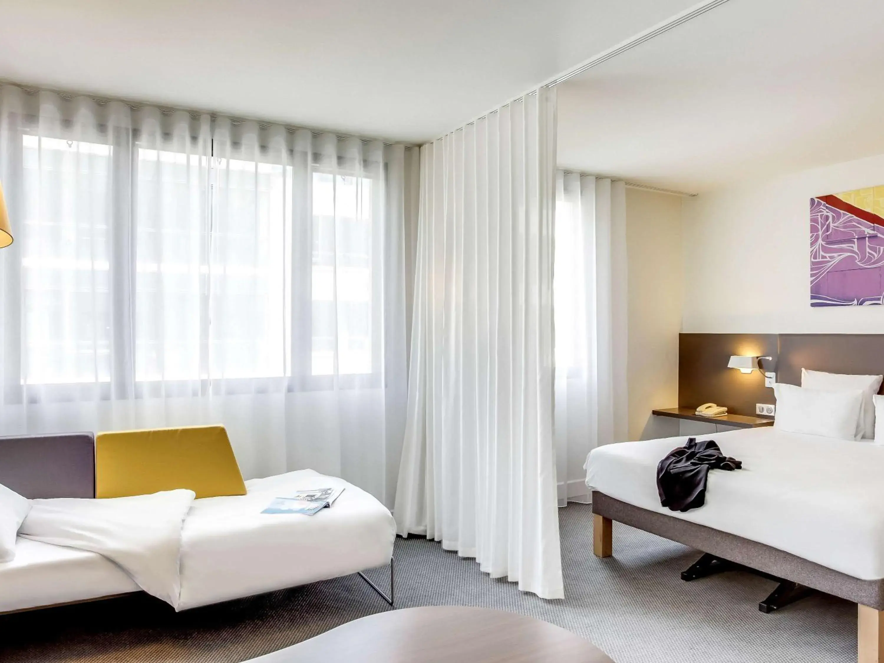 Photo of the whole room, Bed in Novotel Suites Paris Stade de France