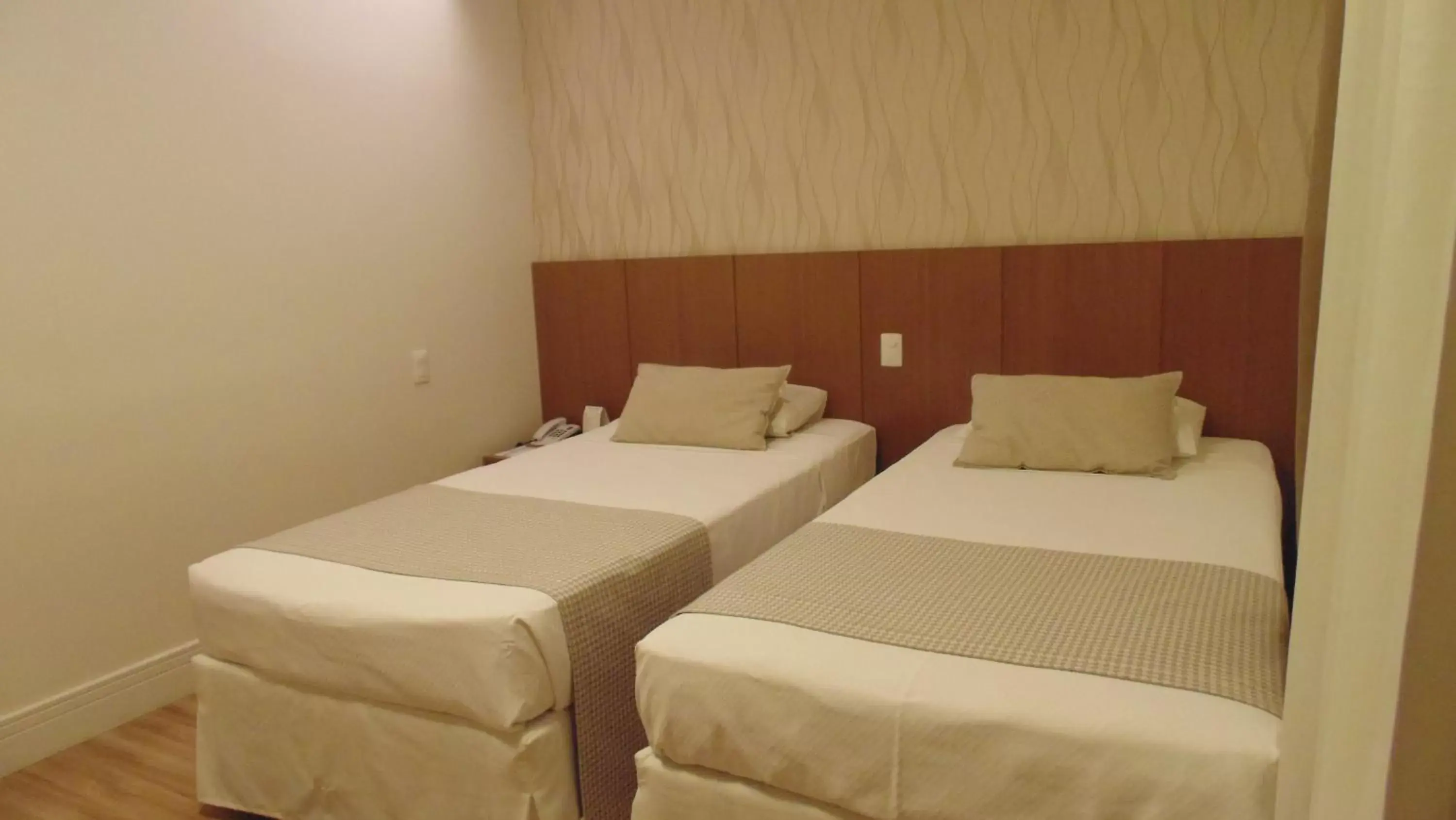 Bed in Mirasol Copacabana Hotel