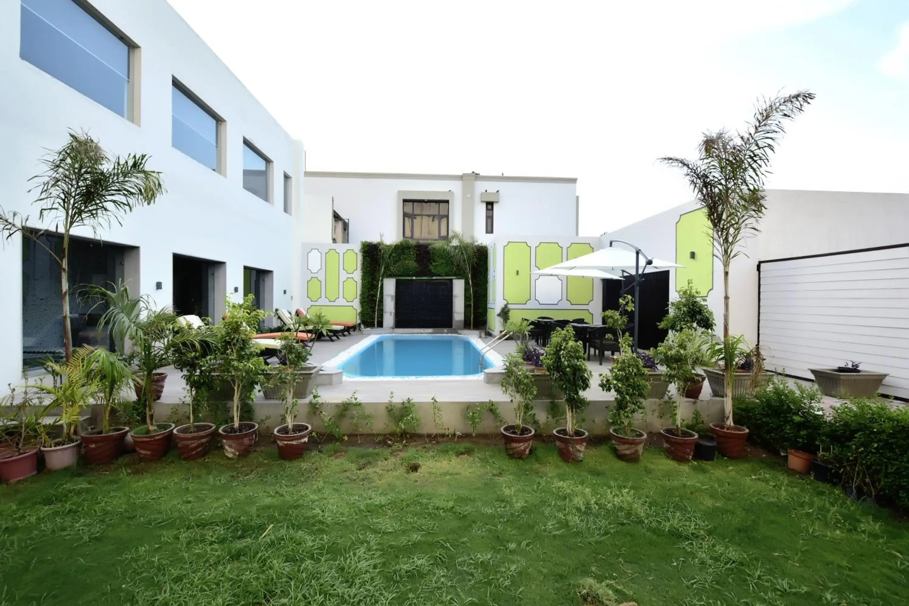 Swimming pool, Property Building in Hotel Gandharva - A Green Hotel