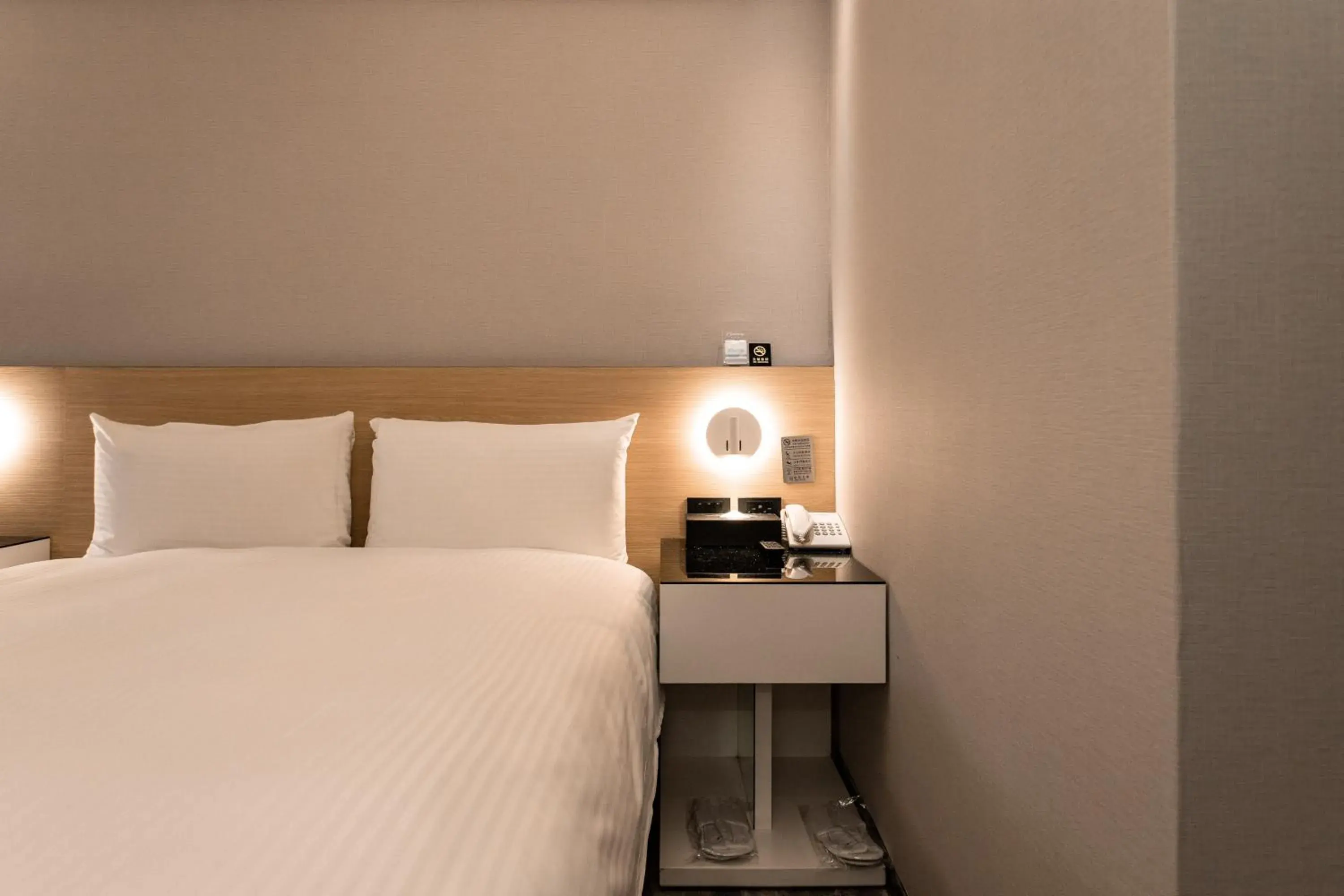 Bed in Hub Hotel Tucheng