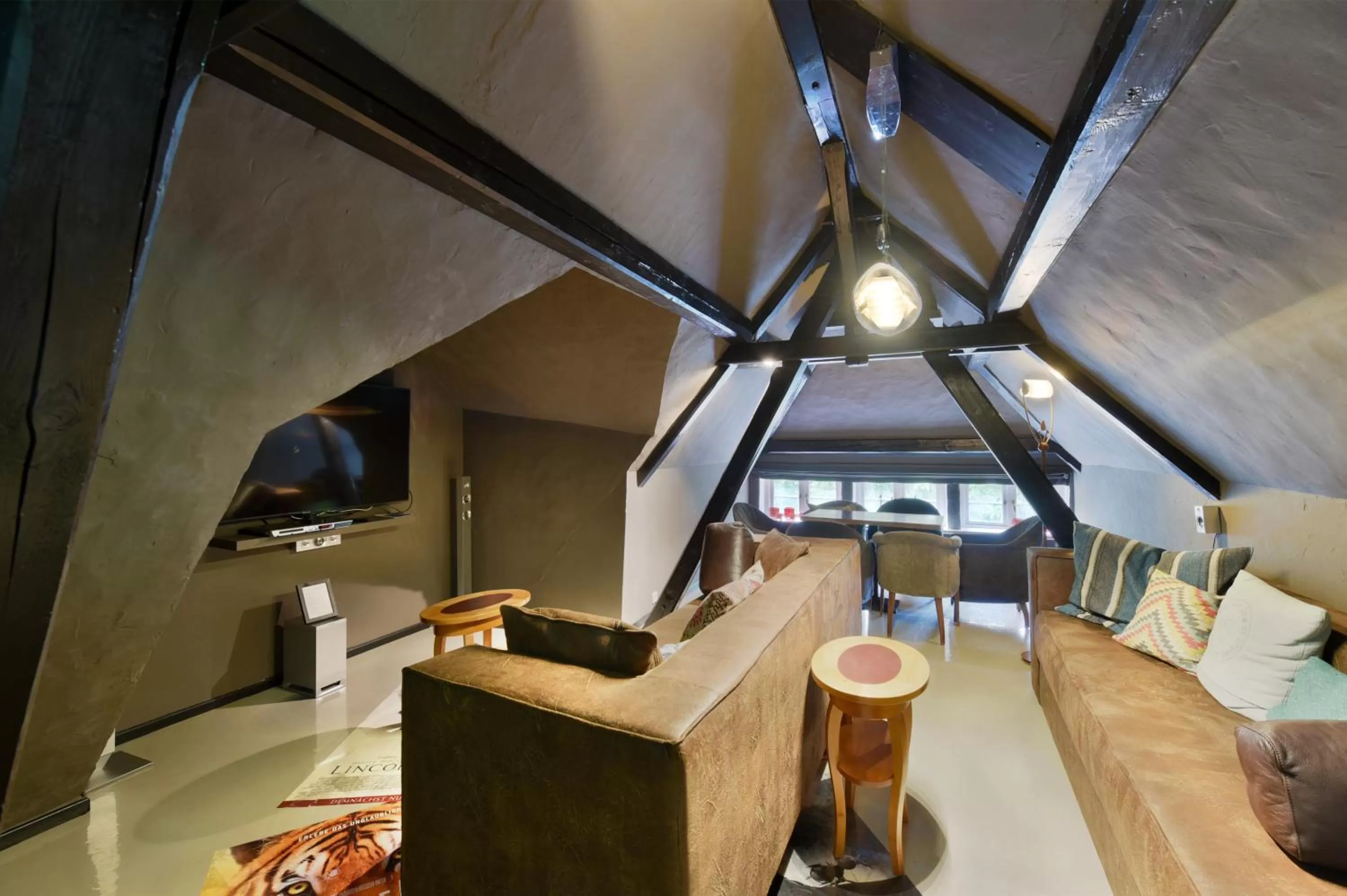 Communal lounge/ TV room in Relais & Châteaux Landhaus Stricker