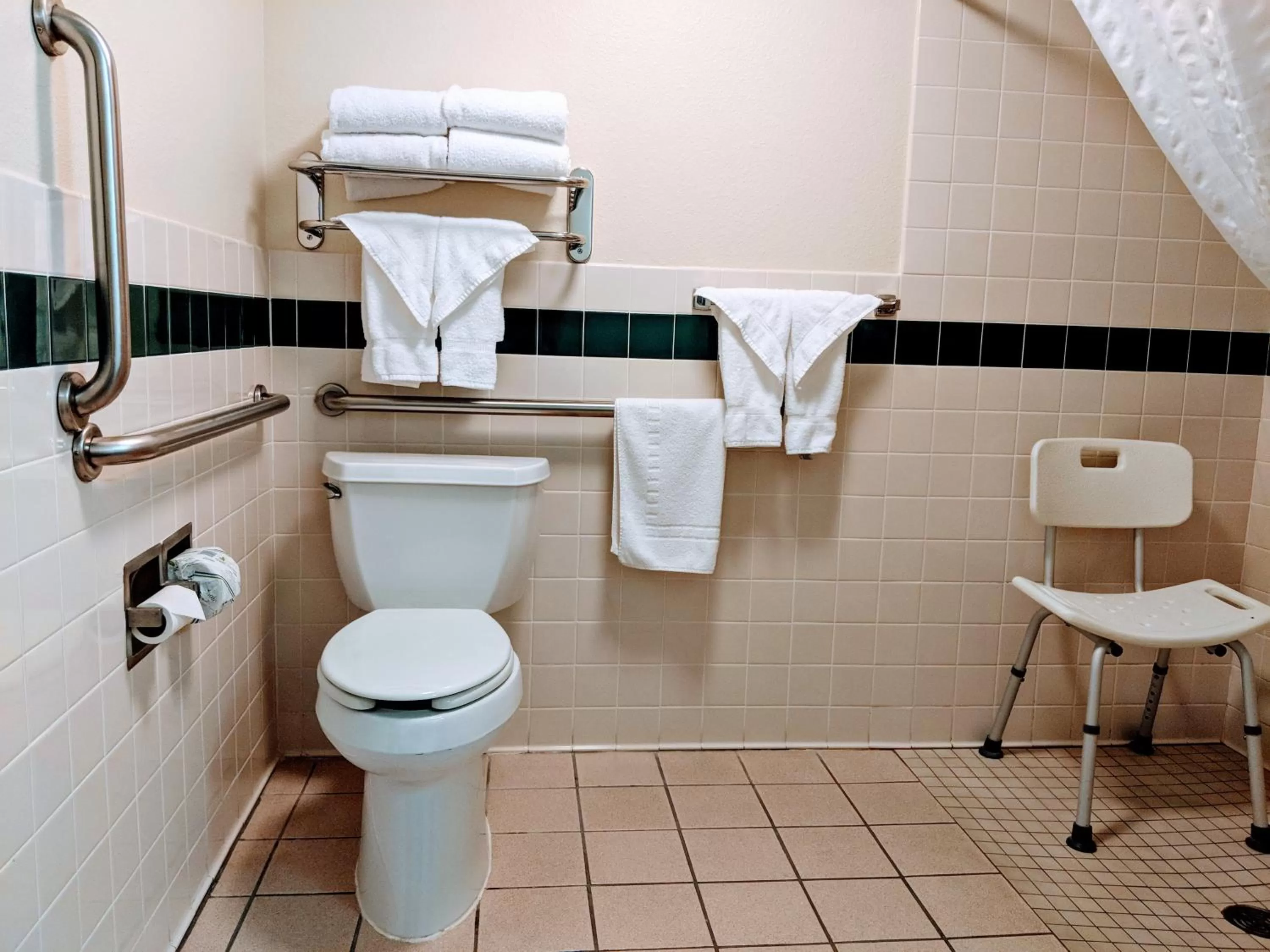 Toilet in AmericInn by Wyndham Grand Forks