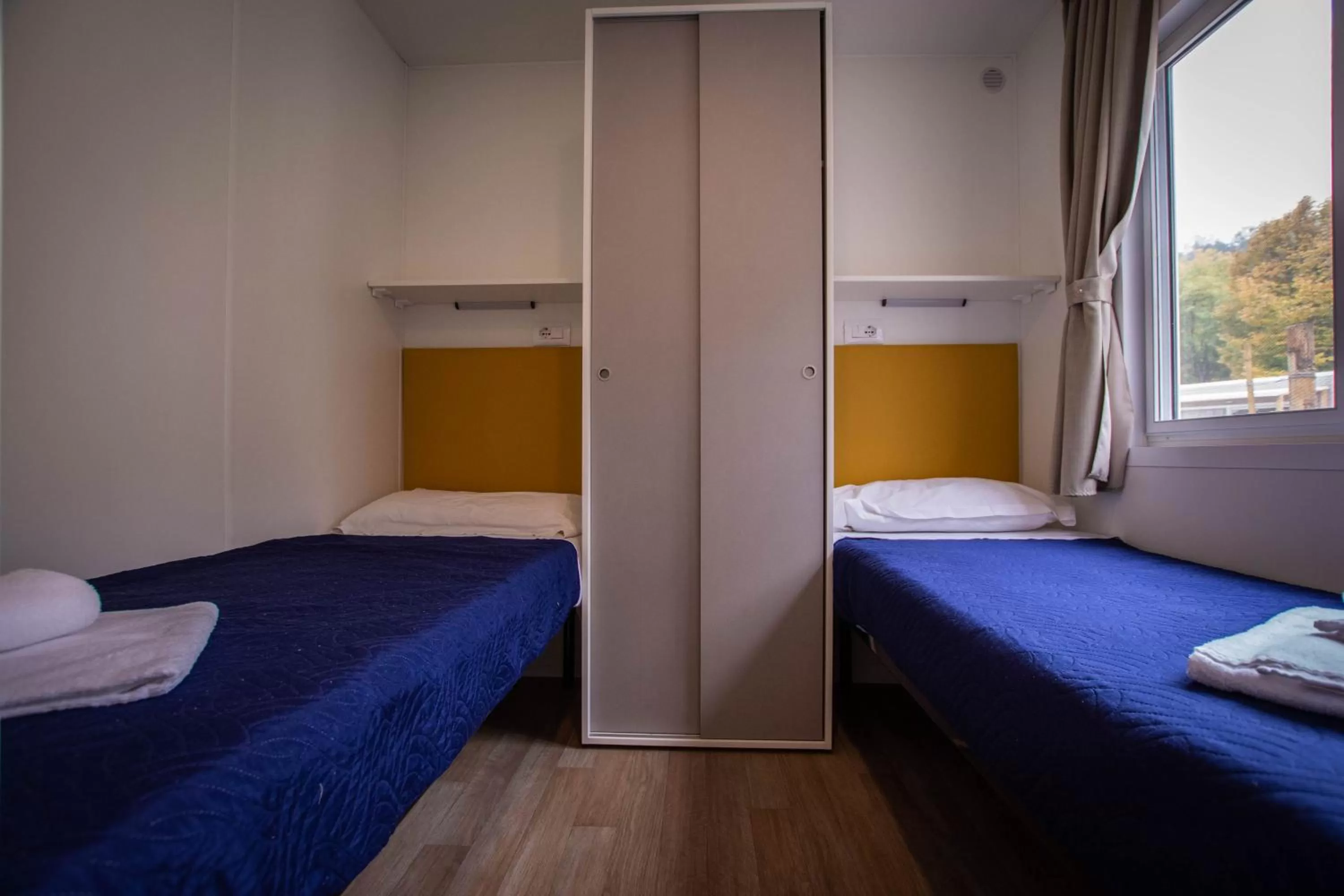 Bed in AgriCamping AlbaVillage Hotel & Wellness