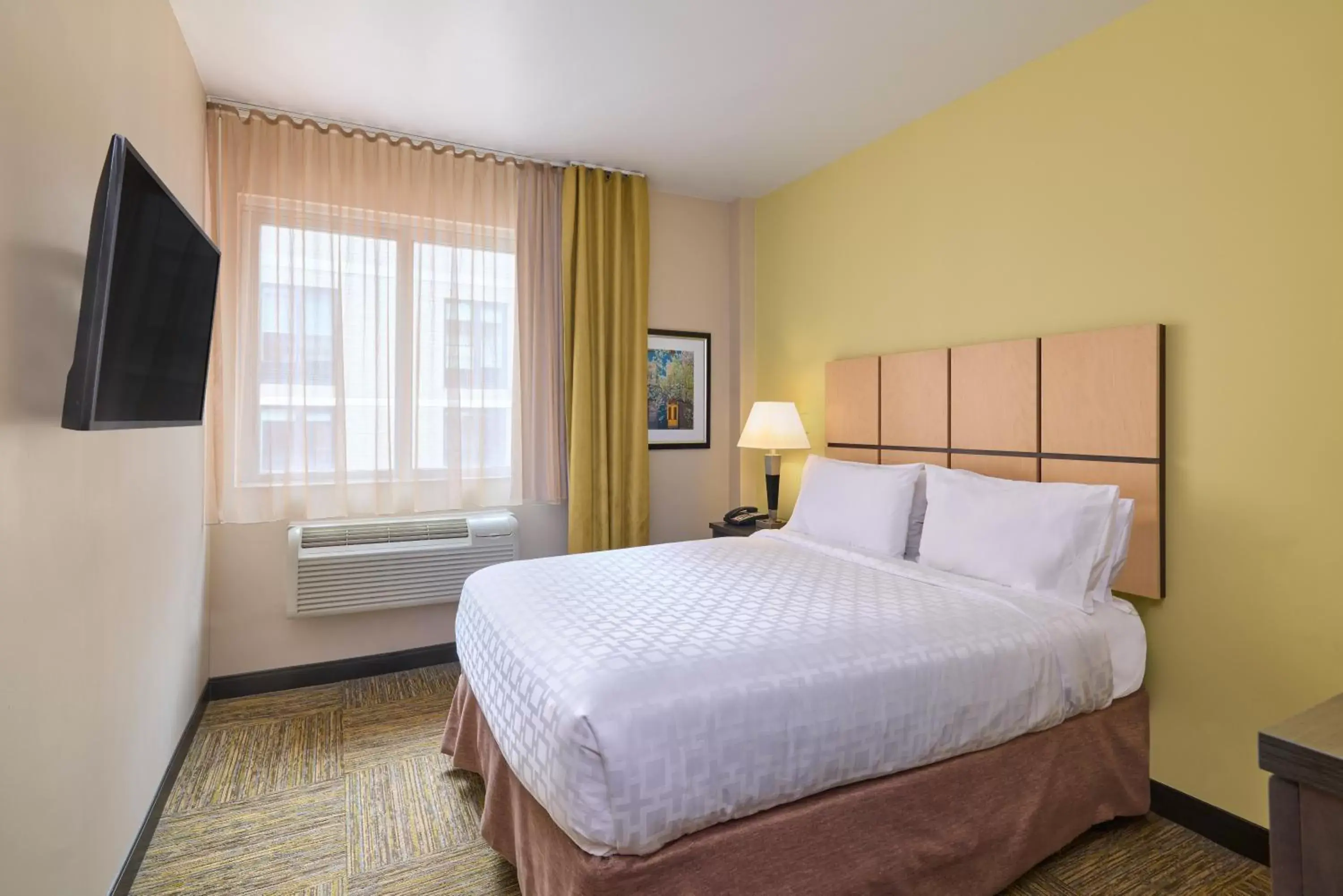 Bed in Candlewood Suites NYC -Times Square, an IHG Hotel