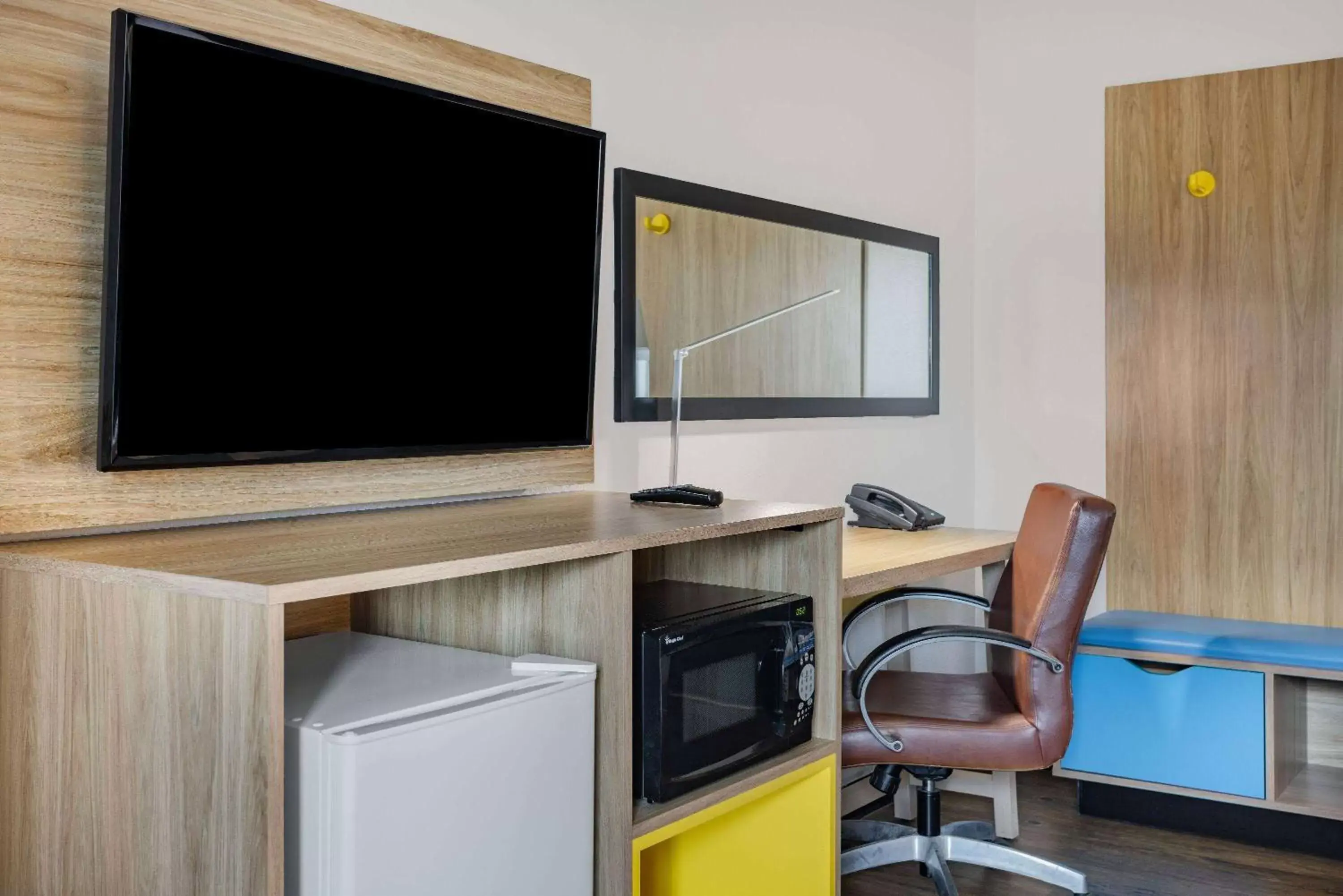 Photo of the whole room, TV/Entertainment Center in Days Inn by Wyndham Raleigh Glenwood-Crabtree