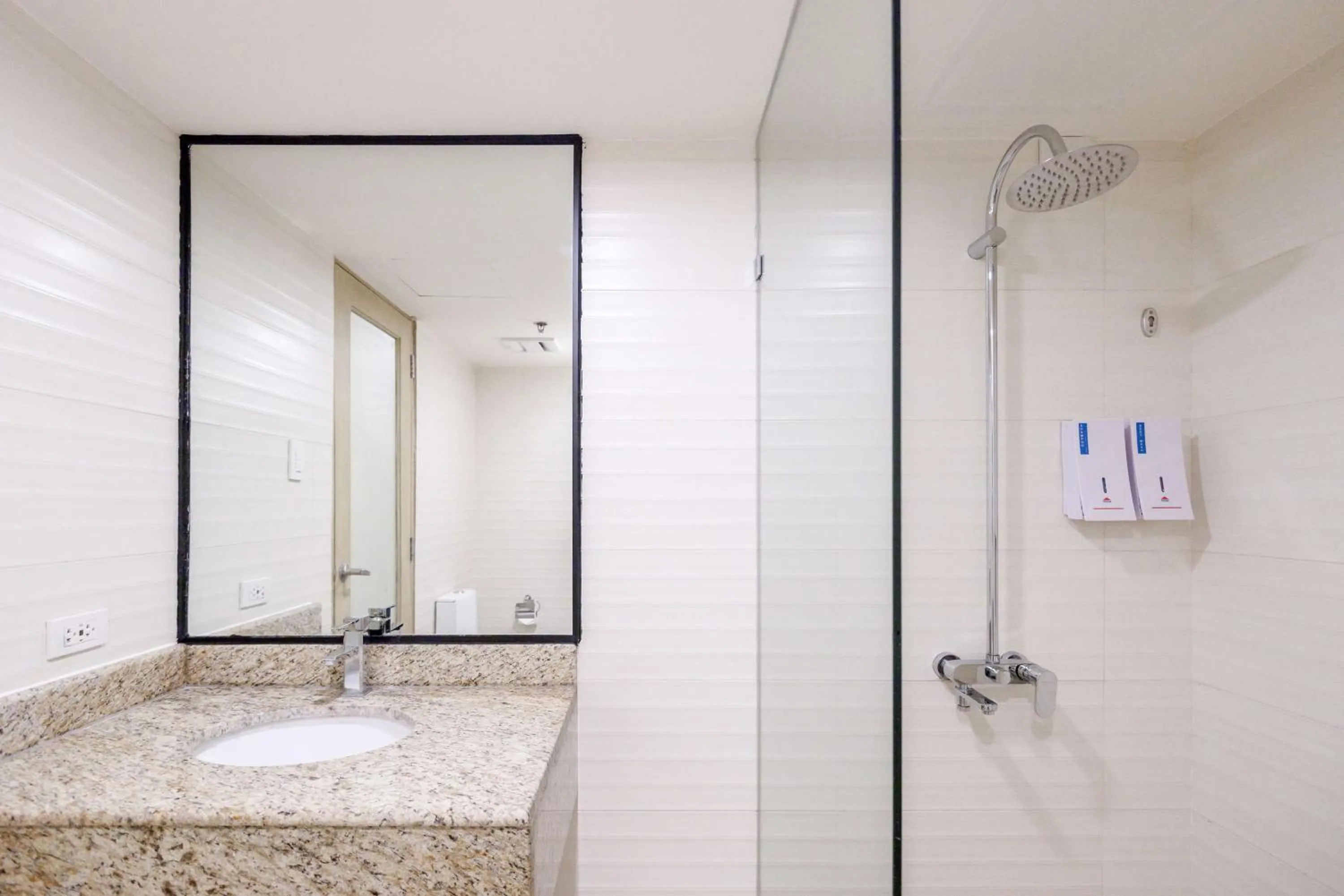 Bathroom in SureStay Plus by Best Western Cebu City