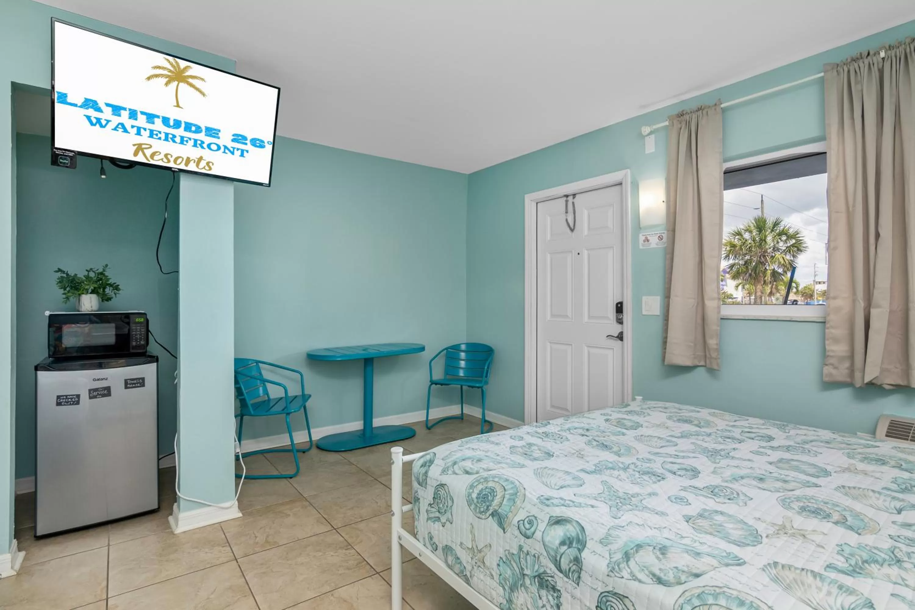 TV and multimedia, Bed in Latitude 26 Waterfront Resort and Marina