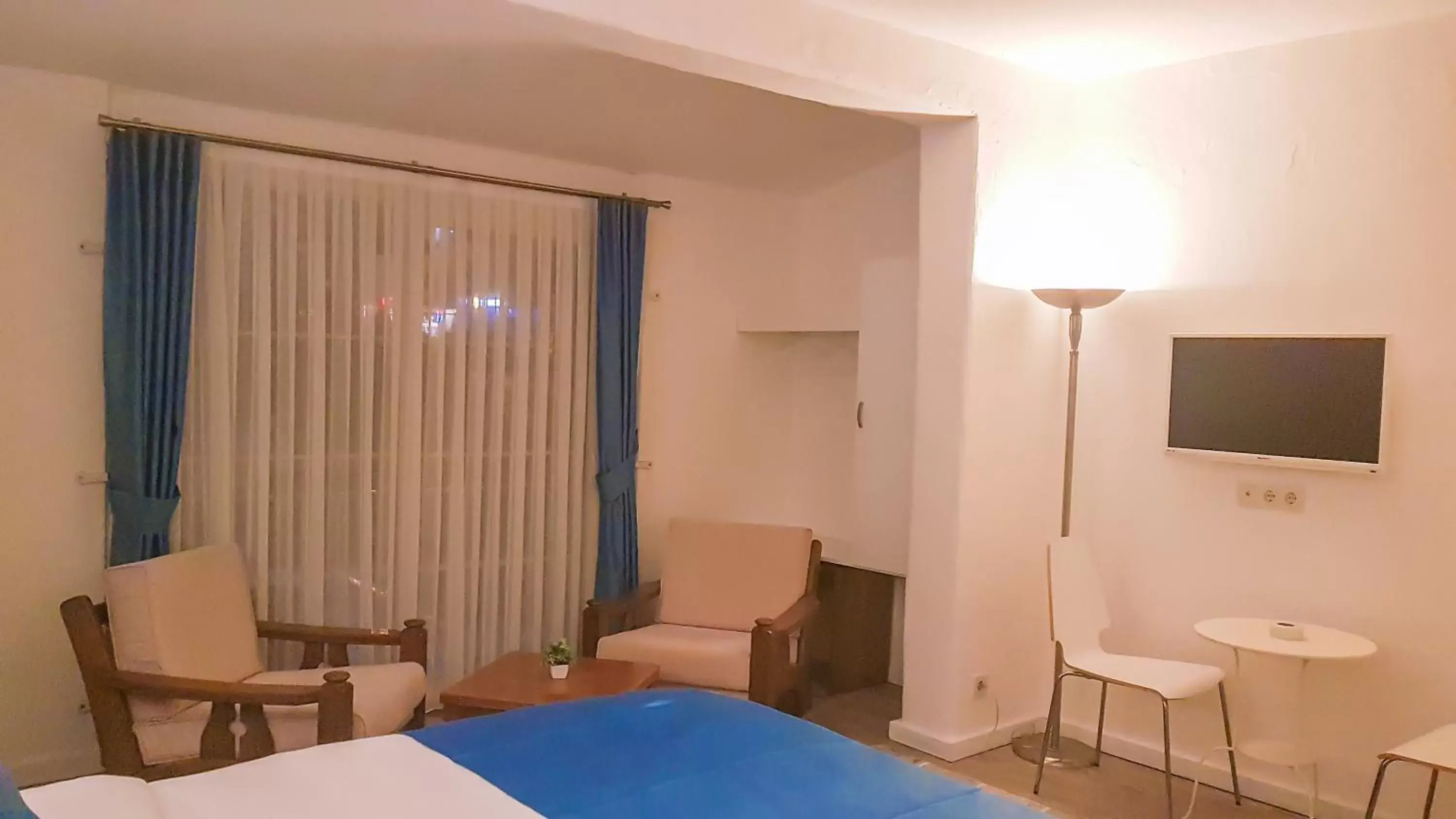 Communal lounge/ TV room, Bed in Rebetiko Hotel