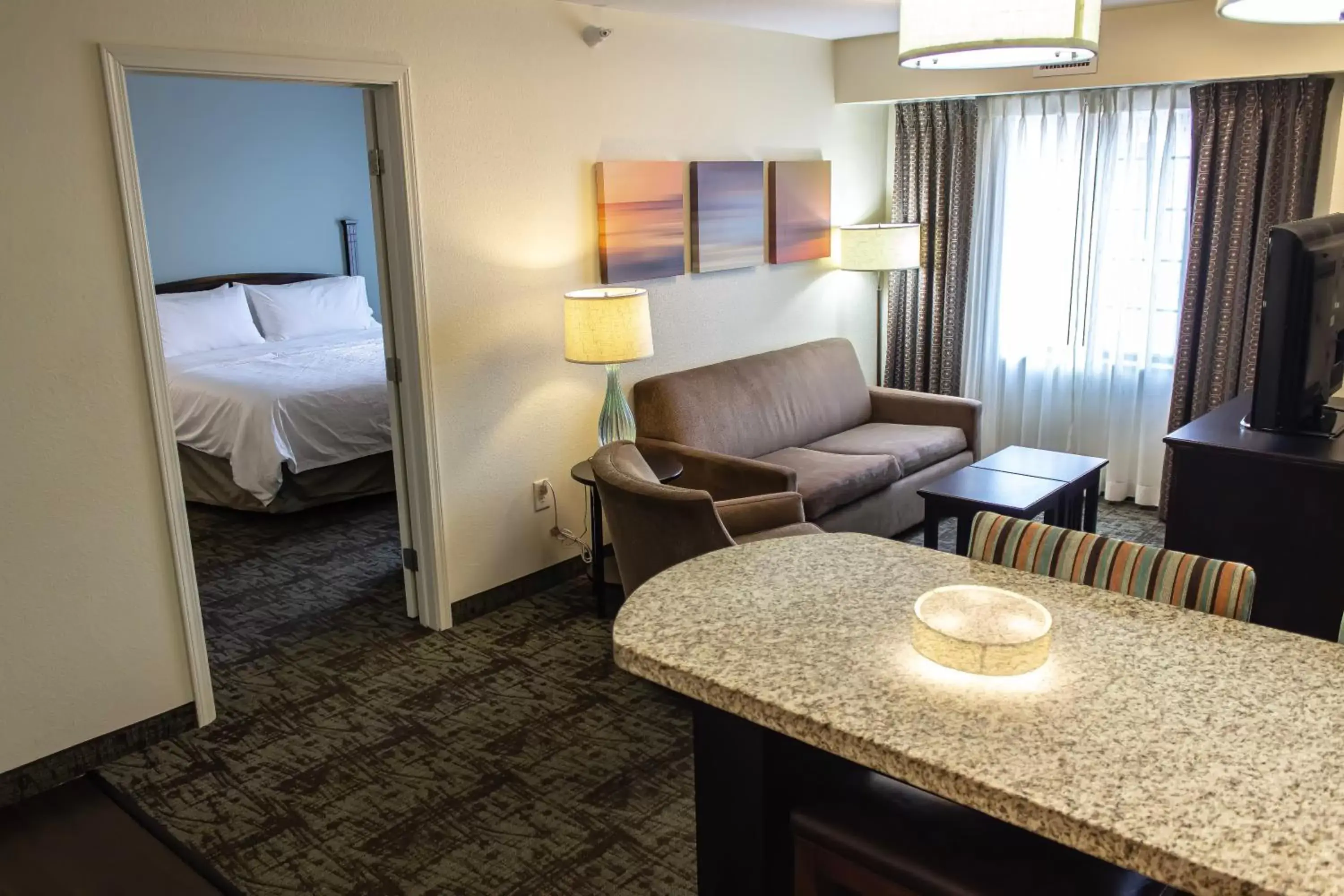 Photo of the whole room, Seating Area in Staybridge Suites Minot, an IHG Hotel