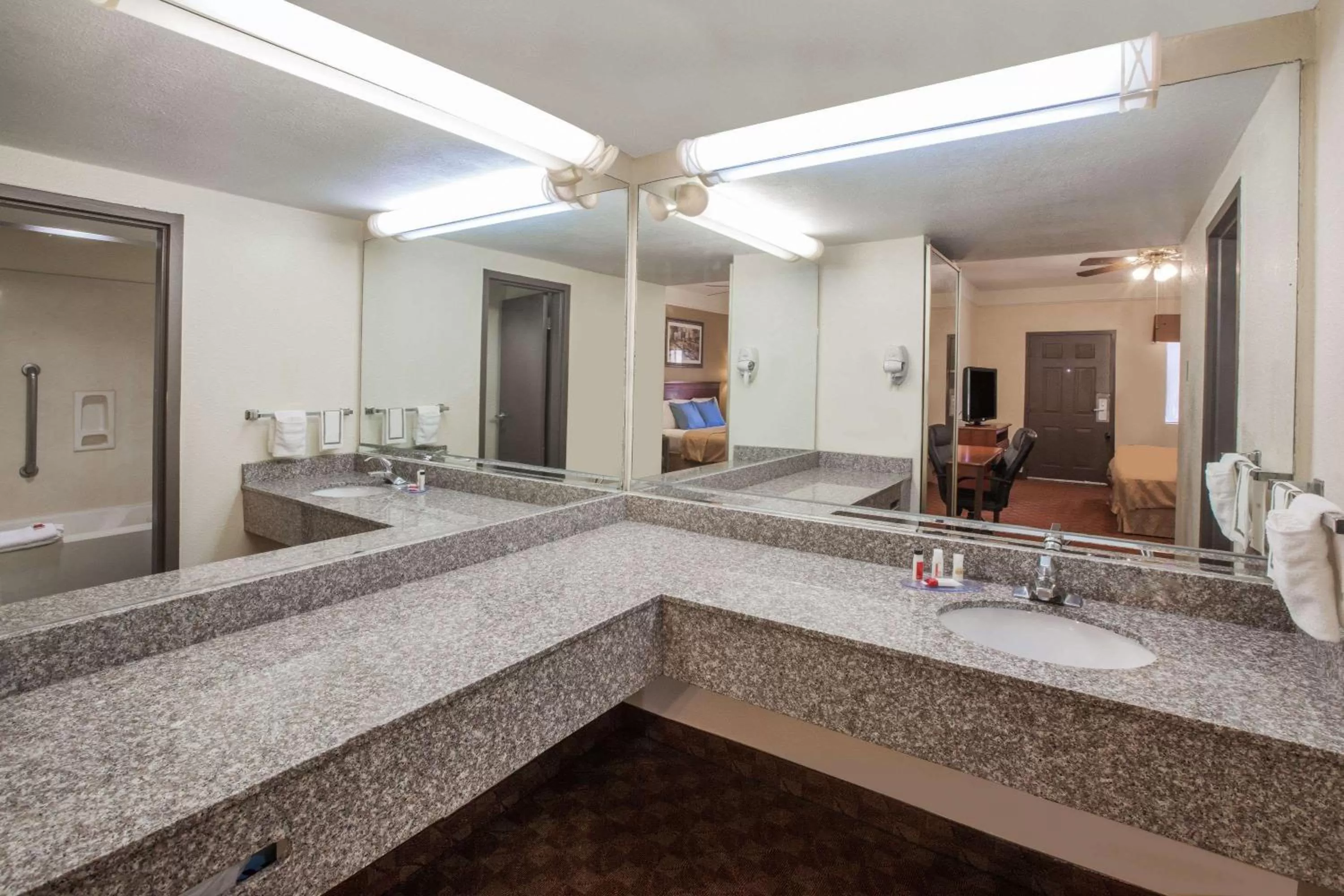 Bathroom in Days Inn & Suites by Wyndham Webster NASA-ClearLake-Houston