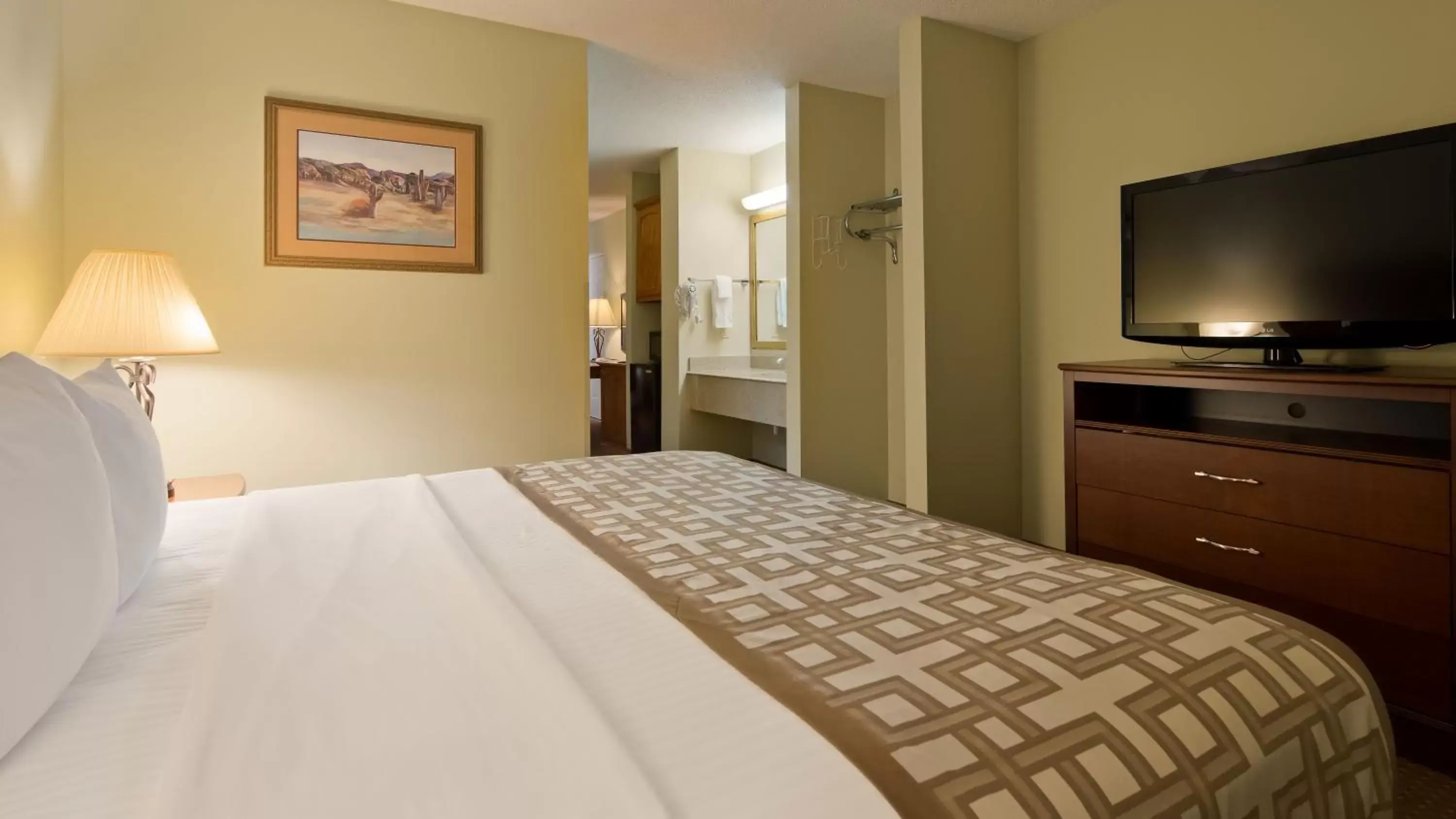 Bed in SureStay Plus Hotel by Best Western Poteau