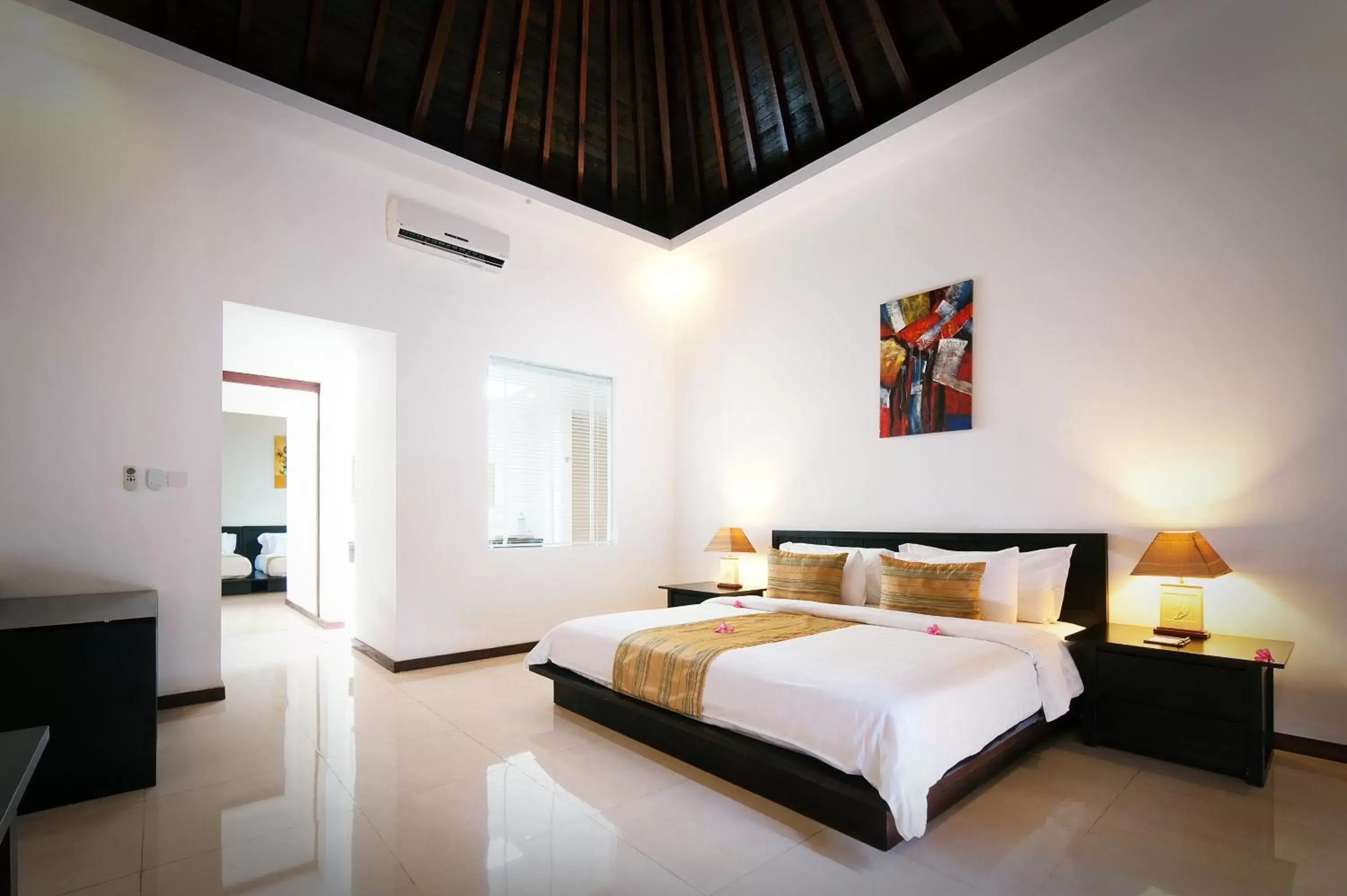 Bed in Kebun Villas & Resort