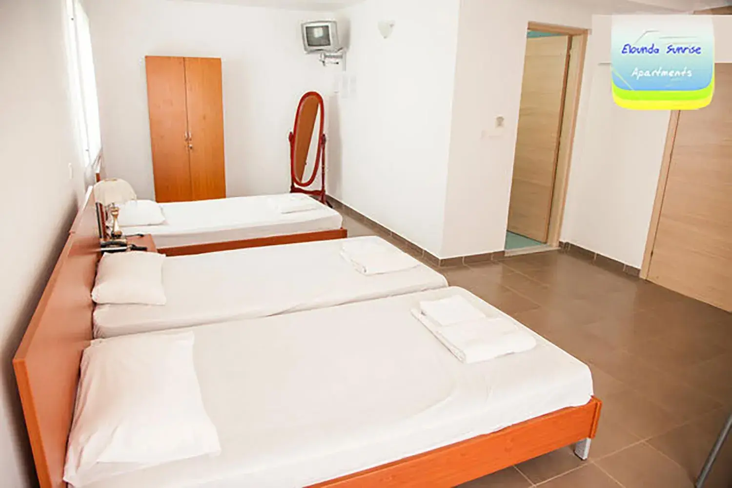 Bed in Elounda Sunrise Apartments