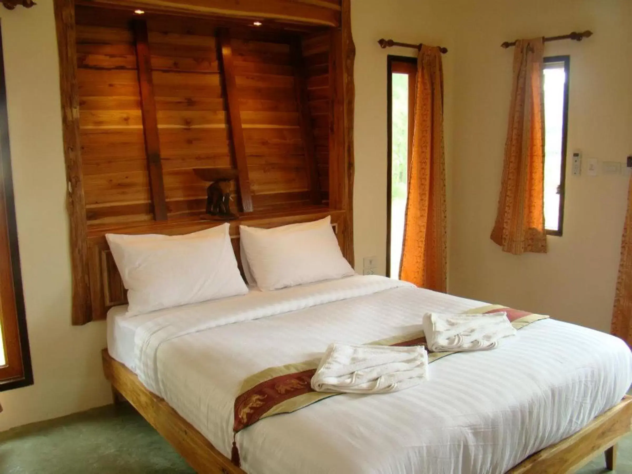 Bed in Pai Iyara Resort