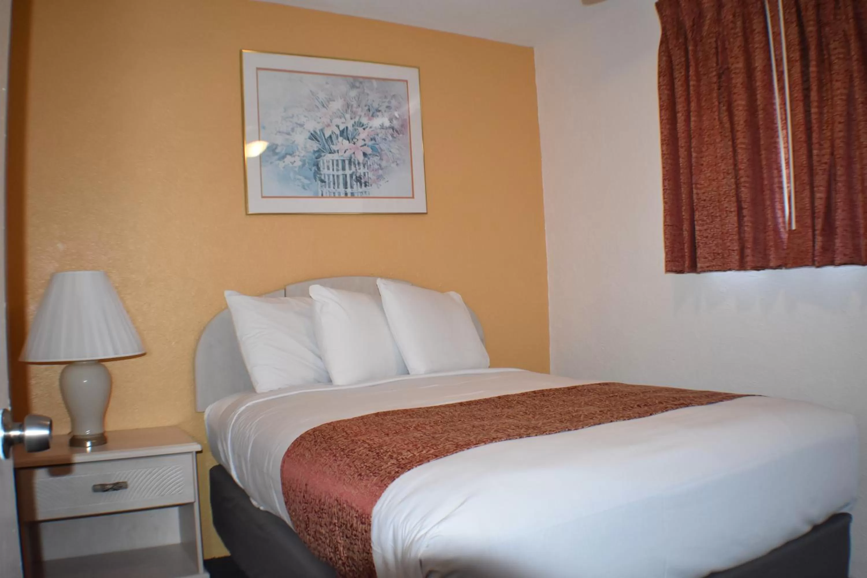 Bed in Blue Water Motel