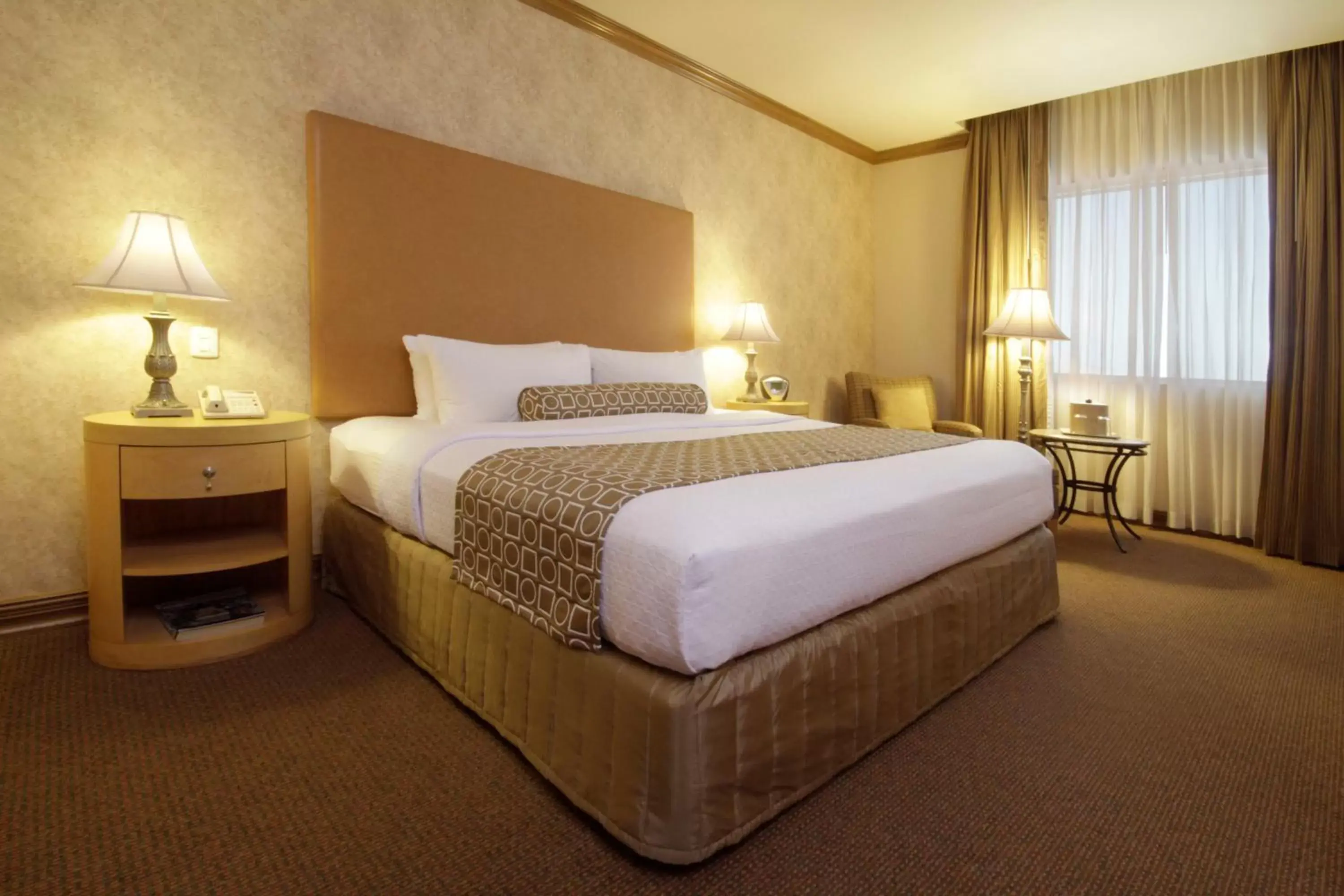 Bed in Crowne Plaza Torreon, an IHG Hotel