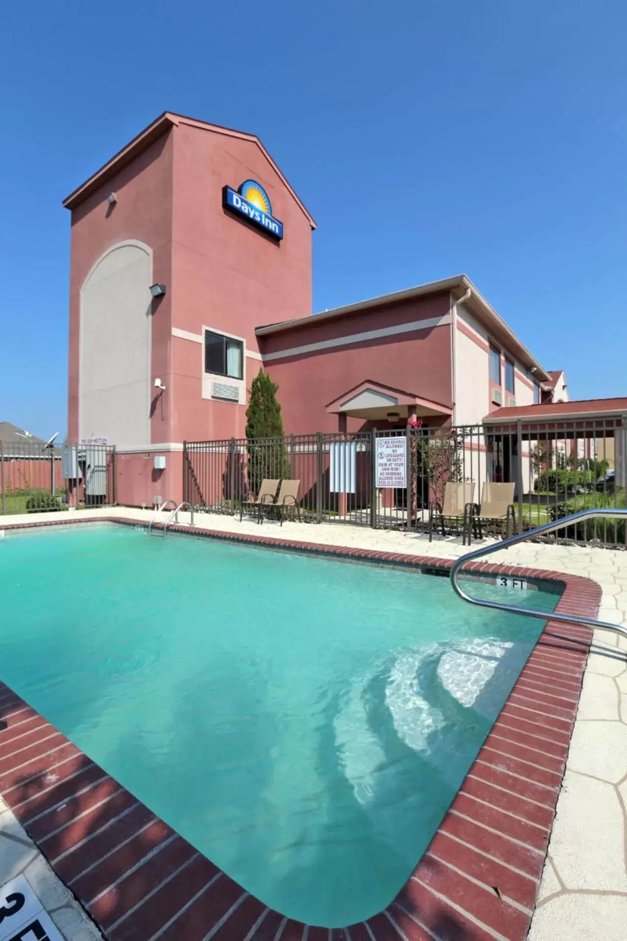 Swimming pool, Property Building in Days Inn by Wyndham Lumberton