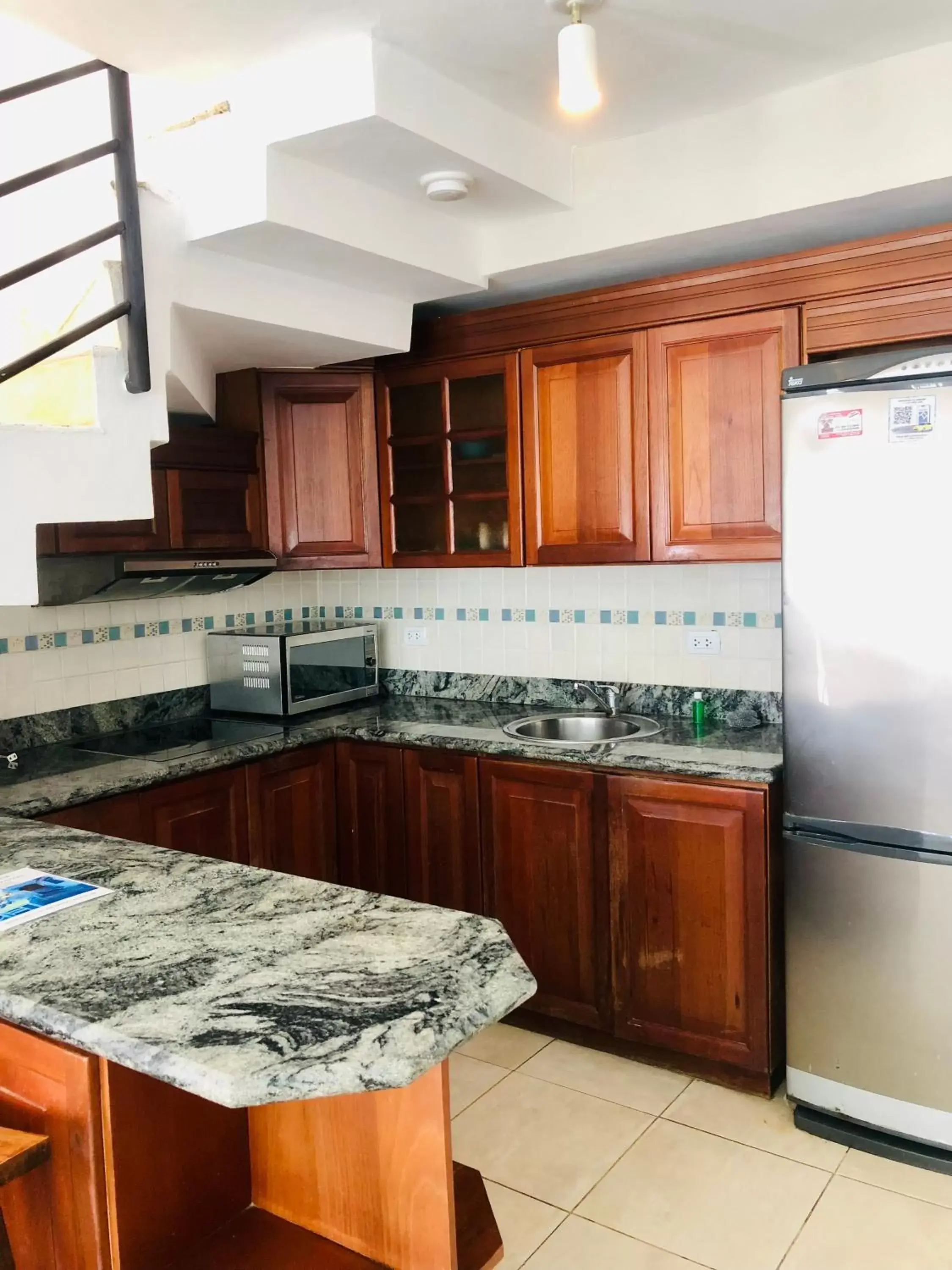 Kitchen/Kitchenette in Los Corales Luxury Villas Beach Club and Spa