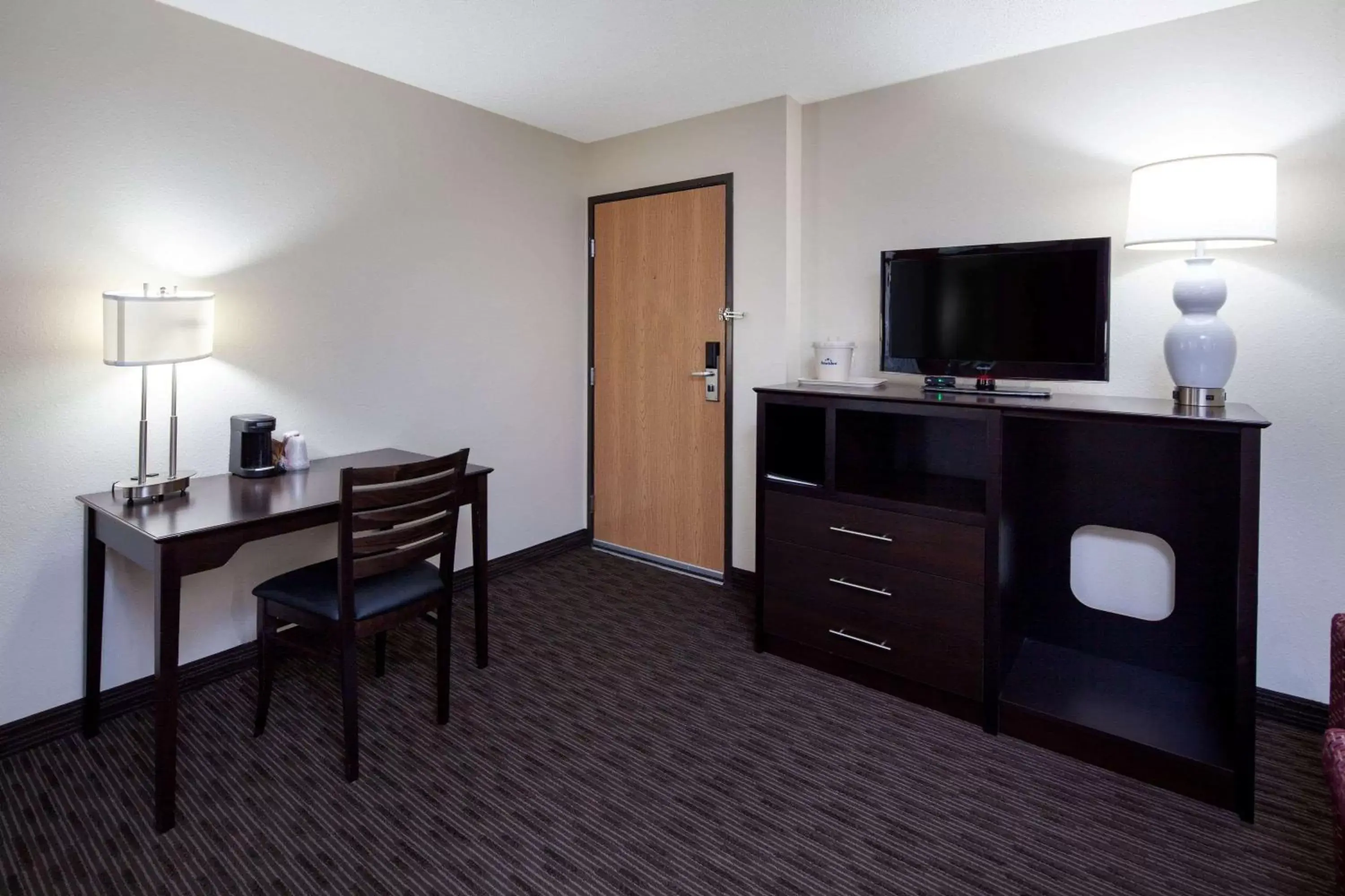 Photo of the whole room, TV/Entertainment Center in AmericInn by Wyndham Northfield