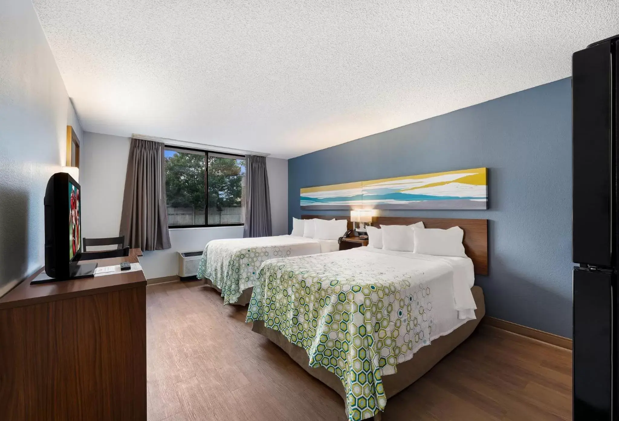 Photo of the whole room, Bed in HomeTowne Studios by Red Roof Painted Post Photo of the whole room, Bed in HomeTowne Studios by Red Roof Painted Post