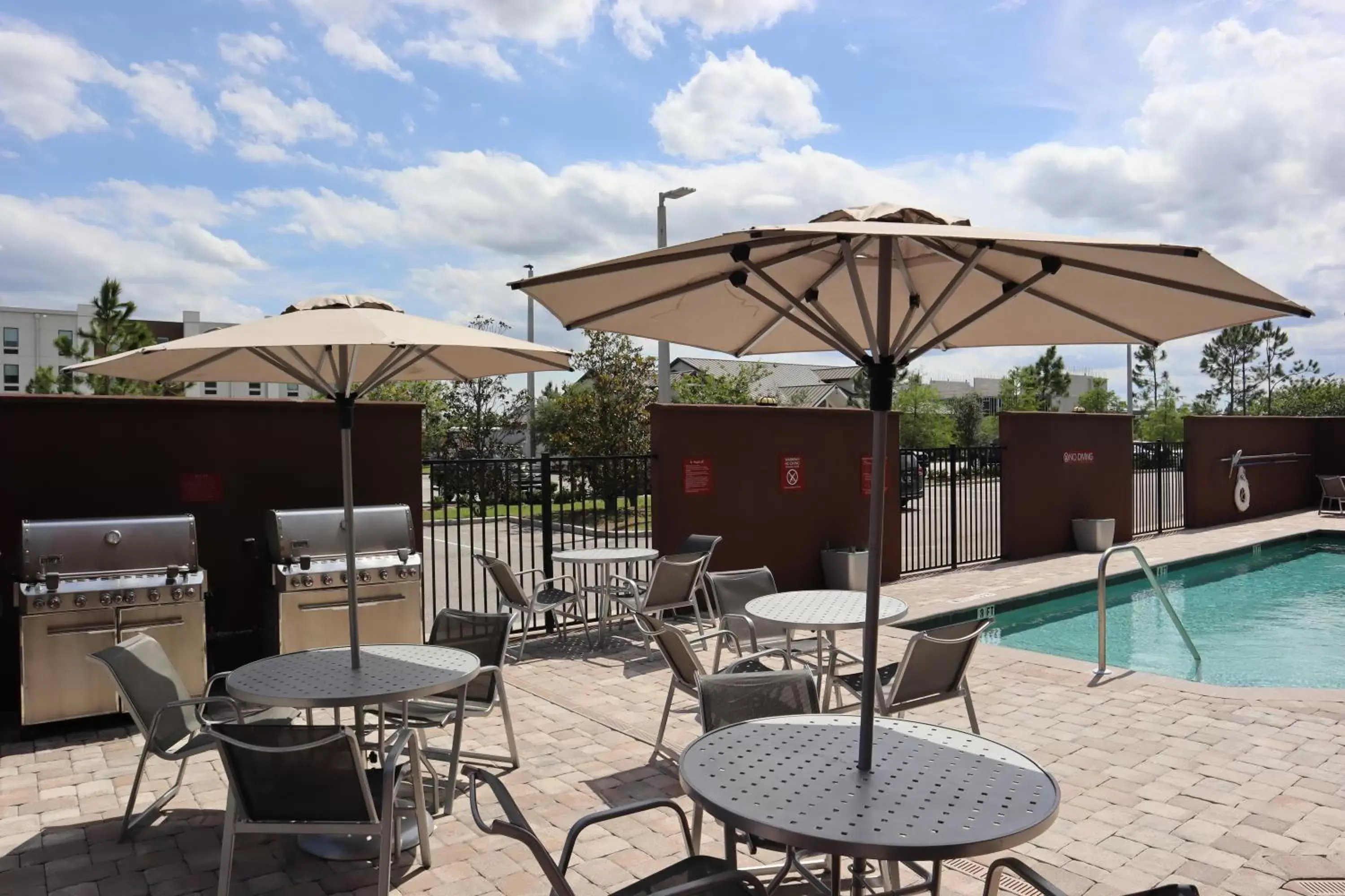 Seating area, Swimming Pool in TownePlace Suites by Marriott Titusville Kennedy Space Center