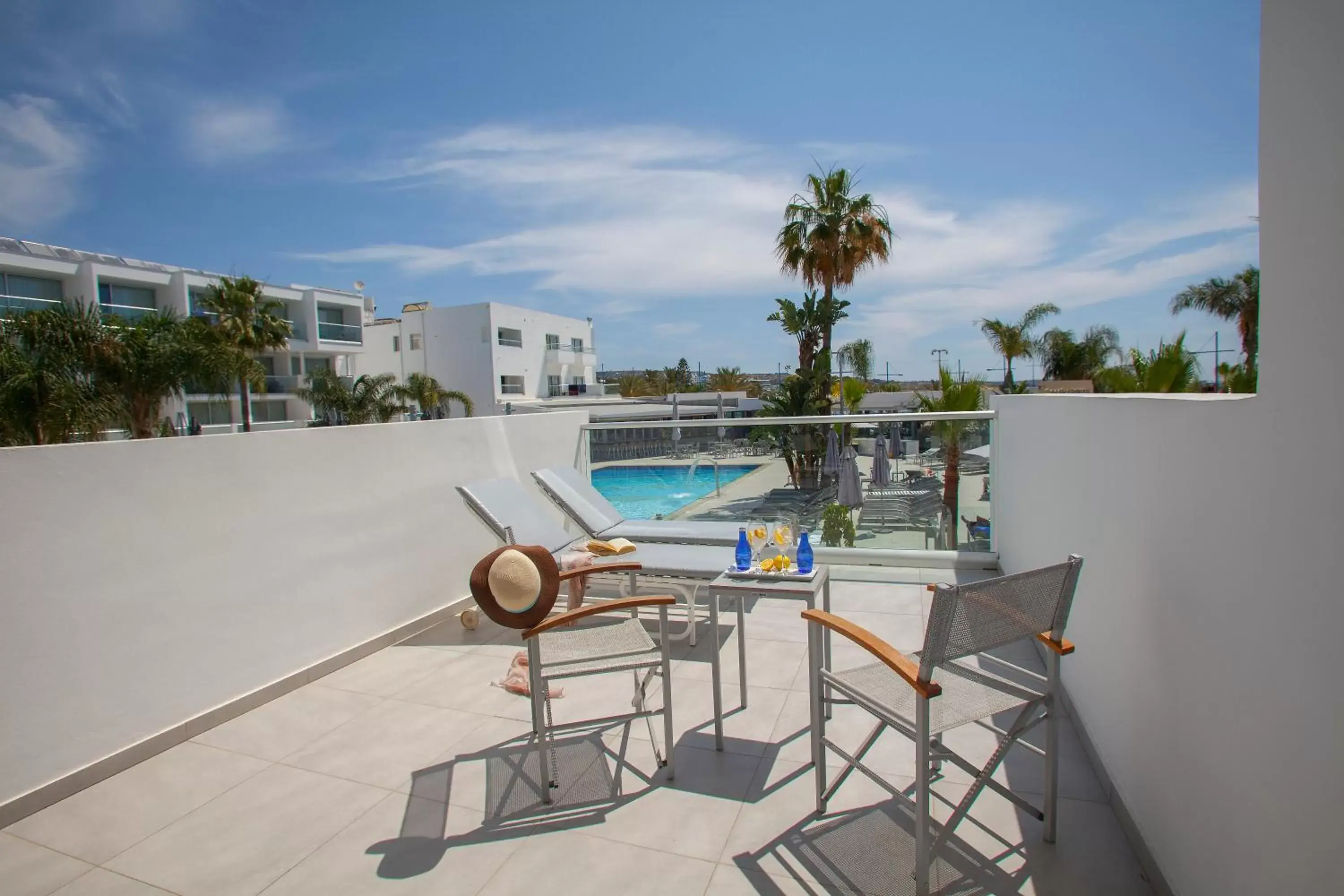 Balcony/Terrace, Swimming Pool in Limanaki Beach Hotel & Suites